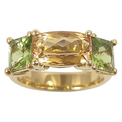 Bague en or 18 carats avec topaze impériale et péridot