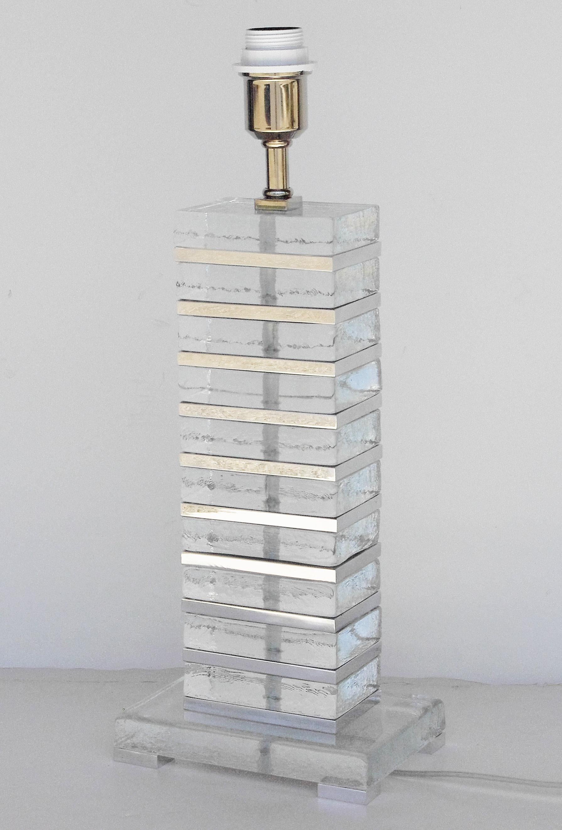 Italian table lamp with clear Murano rectangular glasses and chrome details stacked together to form a piece resembling New York's Empire State building / Designed by Fabio Bergomi for Fabio Ltd / Made in Italy
1 light / E26 or E27 type / max 60W