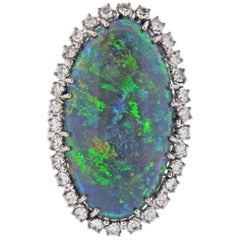 Goldring mit 10,25 Karat schwarzem Opal und Diamant