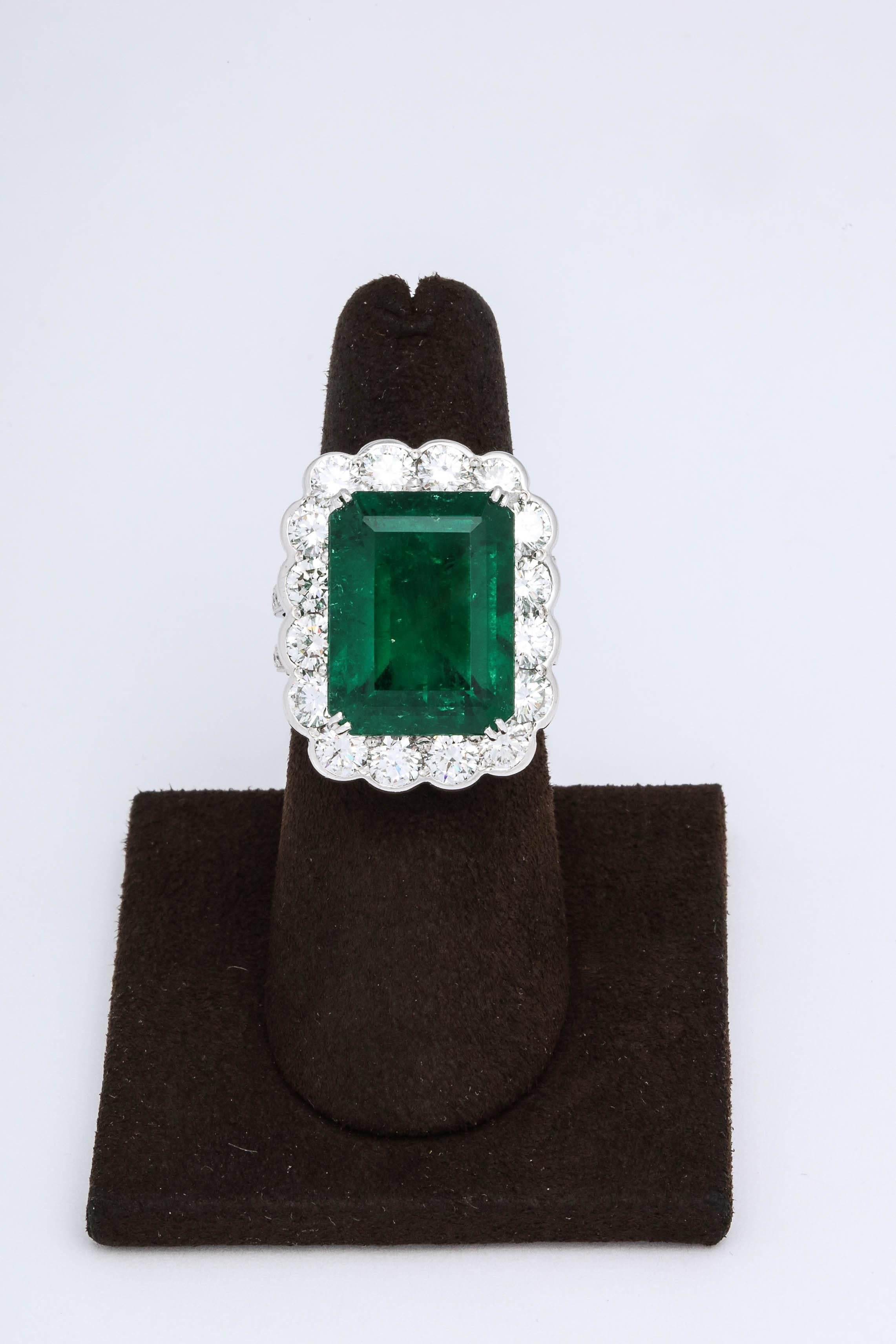 
 A FABULOUS Green Emerald Ring

13.05 carat GIA certified Emerald cut Green Emerald -- beautiful GEM color and luster.

5.03 carats of white round brilliant cut diamonds.

The emerald is from Colombia, GIA states minor clarity enhancement F1

A