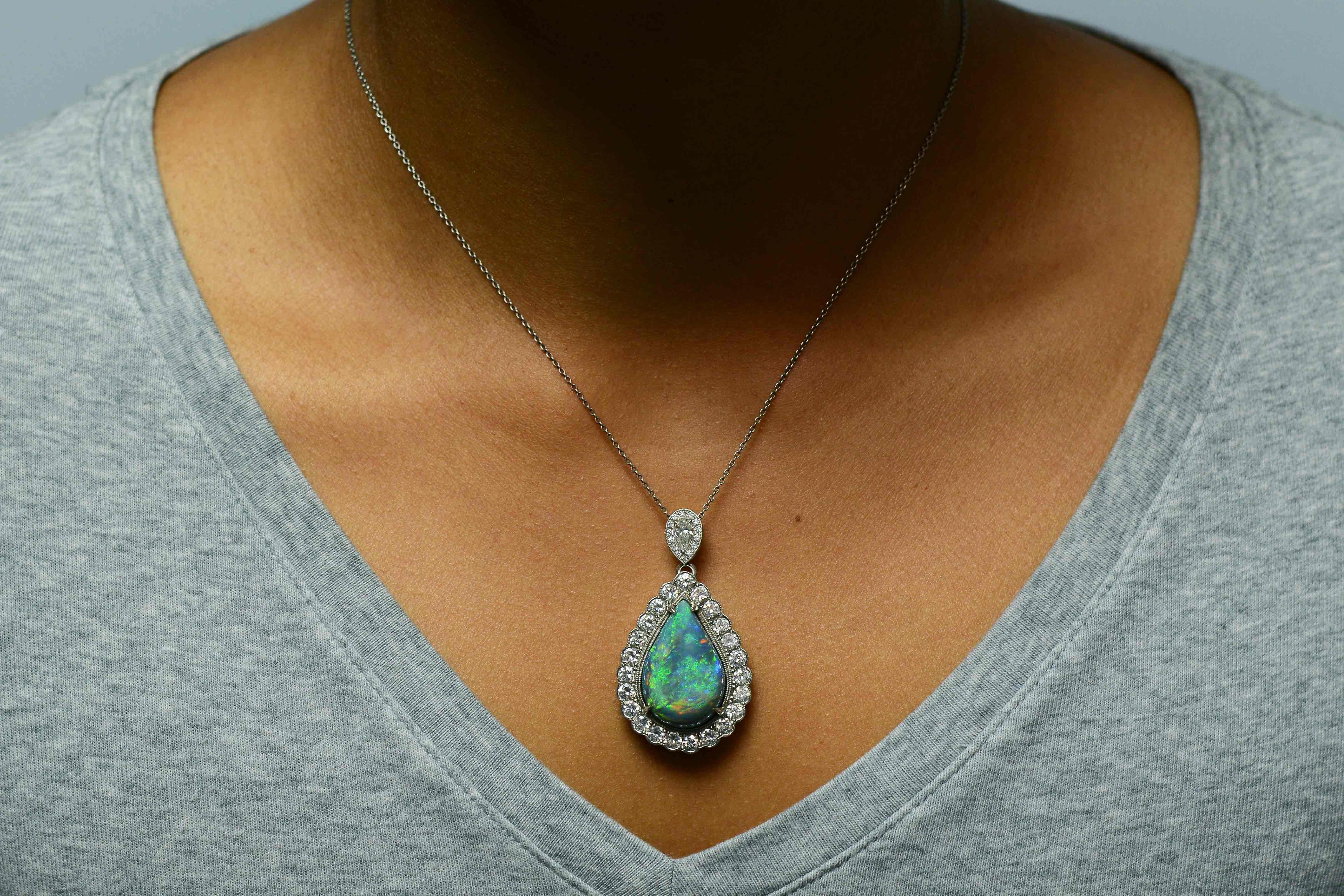 A highly important 16 carat black opal & diamond necklace. The pear shape, teardrop pendant artfully designed as a night on the town statement jewel. Hailed for their unusual and stunning beauty, black opals are the rarest and highly sought after