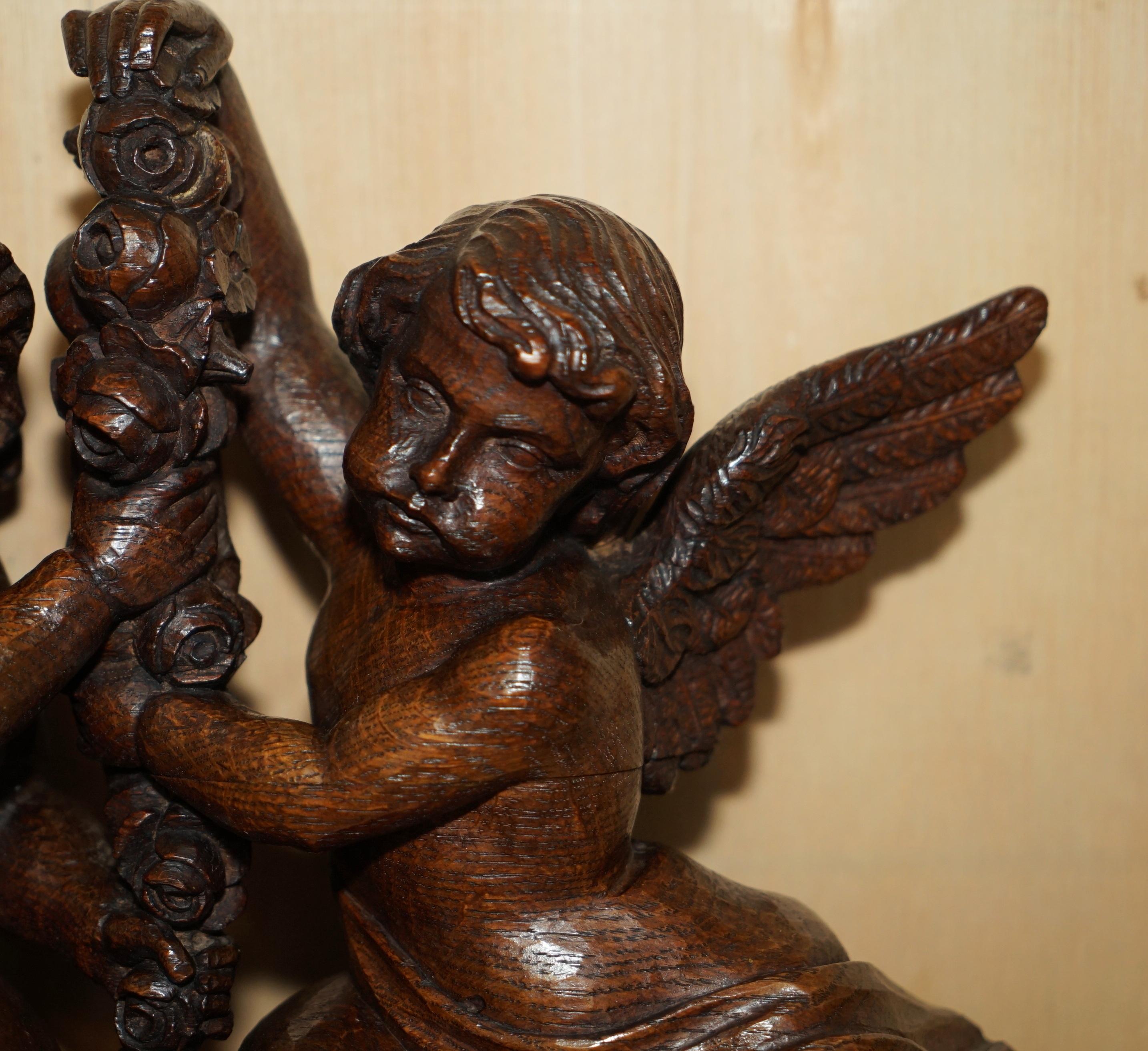 Late 17th Century IMPORTANT 17TH CENTURY CIRCA 1680 OAK CARVED SURMOUNT OF CHERUB ANGELS & FLOWERs For Sale