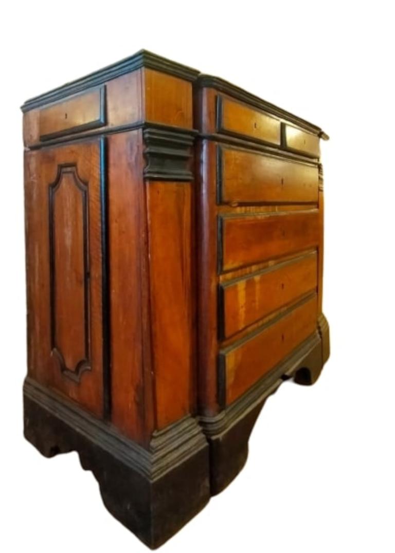 17th-century canter cabinet all original.

Large and impressive 17th-century solid walnut canter cabinet with ebonized frames.
The front of the cabinet has 2 columns at the sides with threaded maple details and ebonized capitals.
In the center