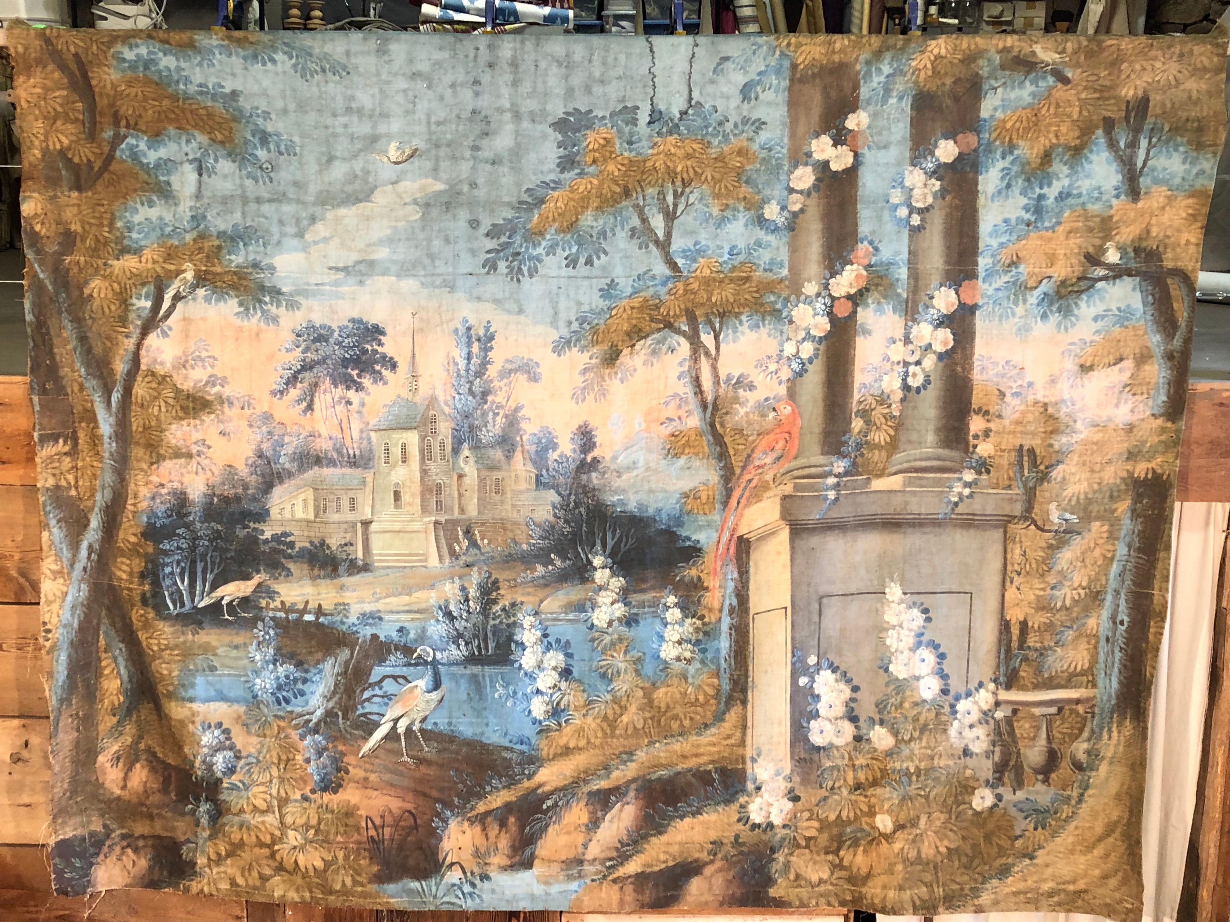 An important and rare room size French 18th century “toile peinte” tapestry, depicting a fantasy landscape and village scene, with birds, trees, flowers etc., attributed to the Tournemine workshop, in Angers, France, by artist Coulet de Beauregard,