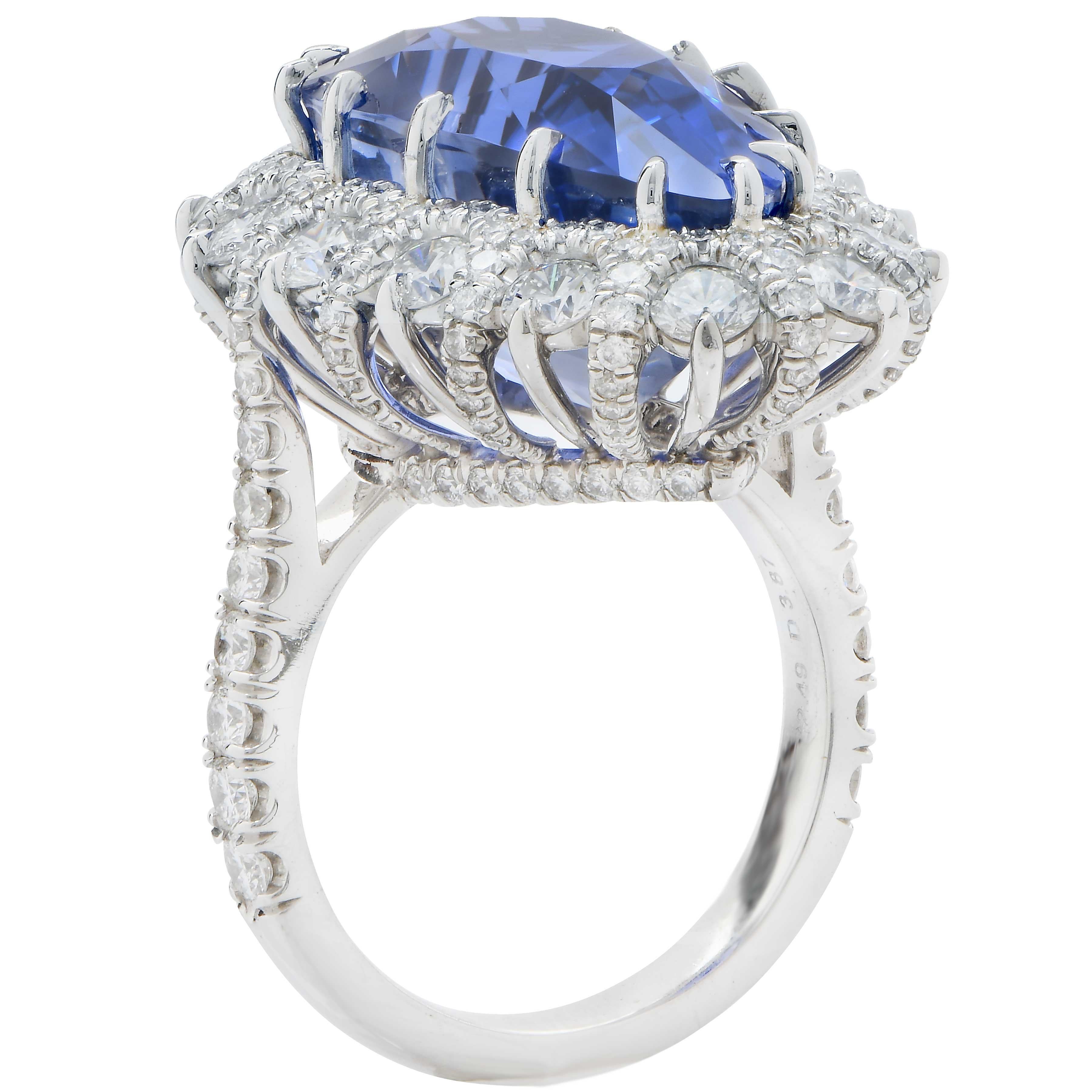 Important hand made platinum diamond ring features a 19 carat AGL Graded Ceylon No Heat pear shaped sapphire surrounded by 3.87 carats of round brilliant cut diamonds.
This one of a kind hand made ring is size six and one half. It can be sized