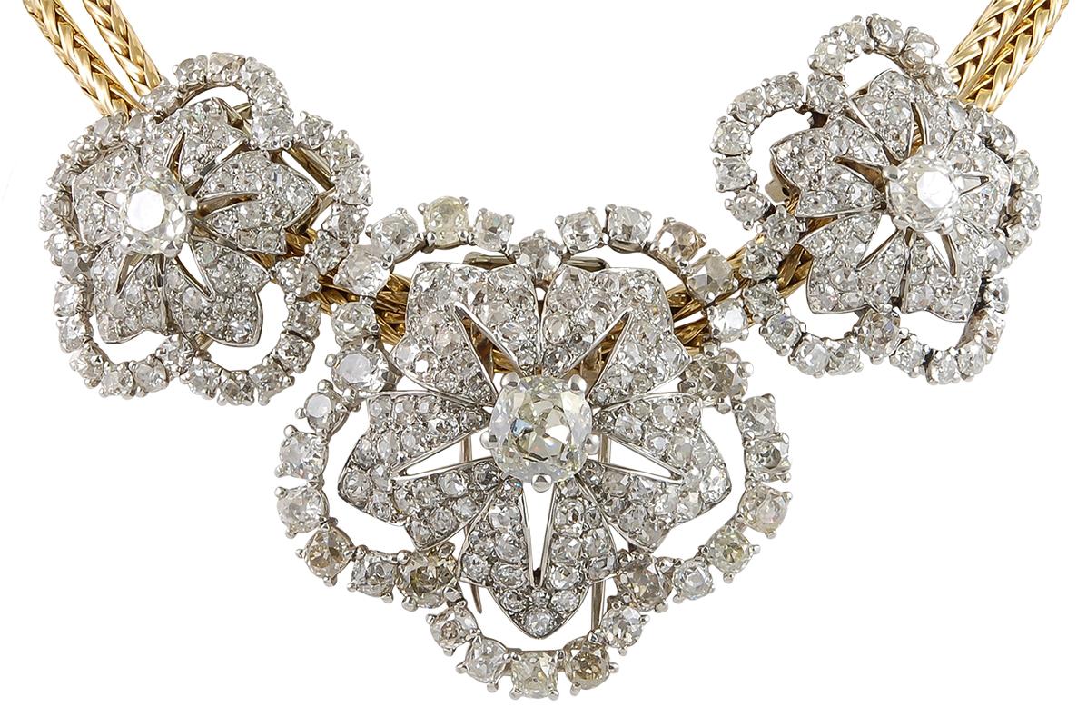 Cartier Paris Diamond Brooch Trio Convertible Necklace in 18k Yellow Gold and Platinum.

An important necklace from Cartier dating from the 1950s that converts into three separate brooches. The flexible serpentine yellow gold chain is intended to be