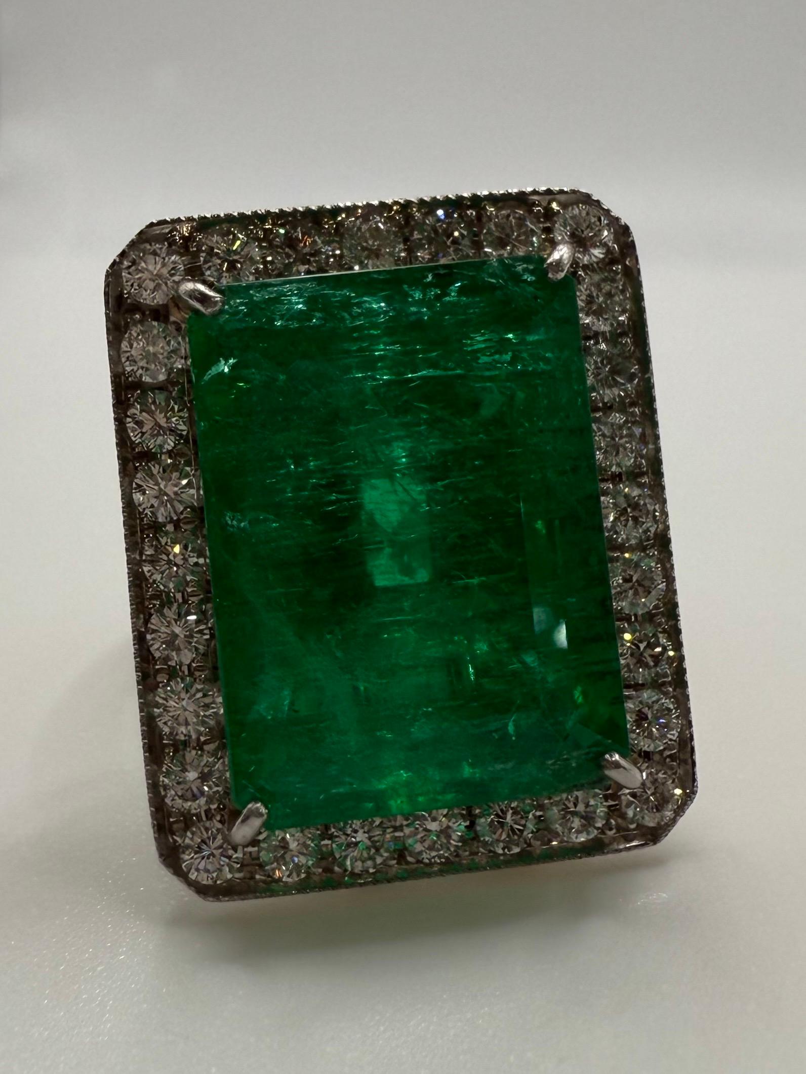 This is an important emerald diamond ring, to find another like this is nearly impossible. Natural Colombian emerald weighing 19.55 carats certified by AGL, made in 18KT yellow gold and platinum. Sized at 7 but can be sized to any size. Diamonds are