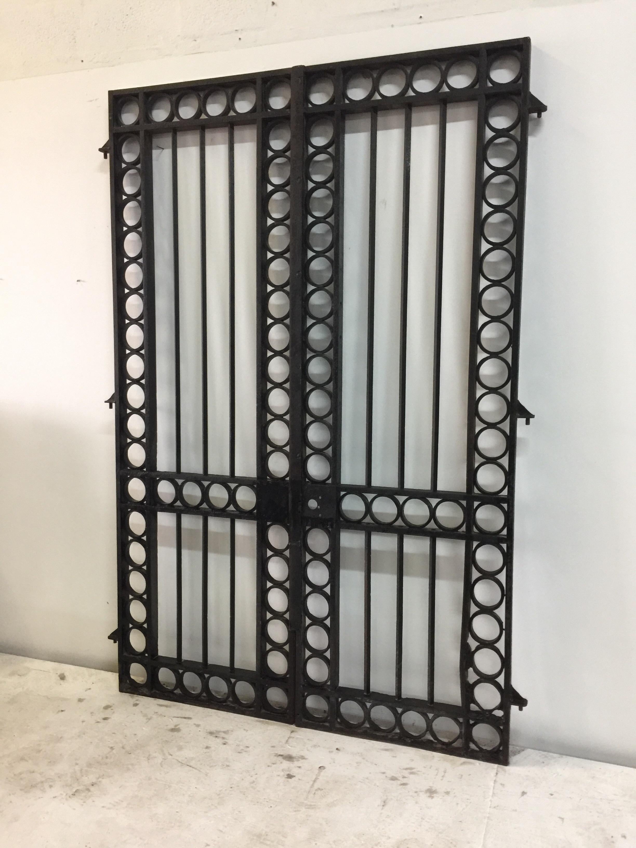 Pair of incredible iron entrance gates from the South of France, circa 19th century. From the estate of the Late Amy Perlin, a well known collector of antiques from around the globe. These gates are extremely heavy and were apparently used near the