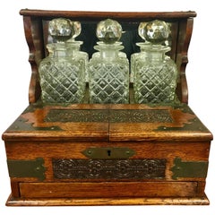 Antique 19th Century English Oak and Crystal Tantalus Decanter Set