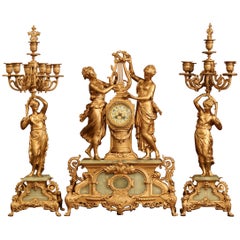 Important ensemble de pendules en métal doré et onyx du 19ème siècle signé E Rancoulet