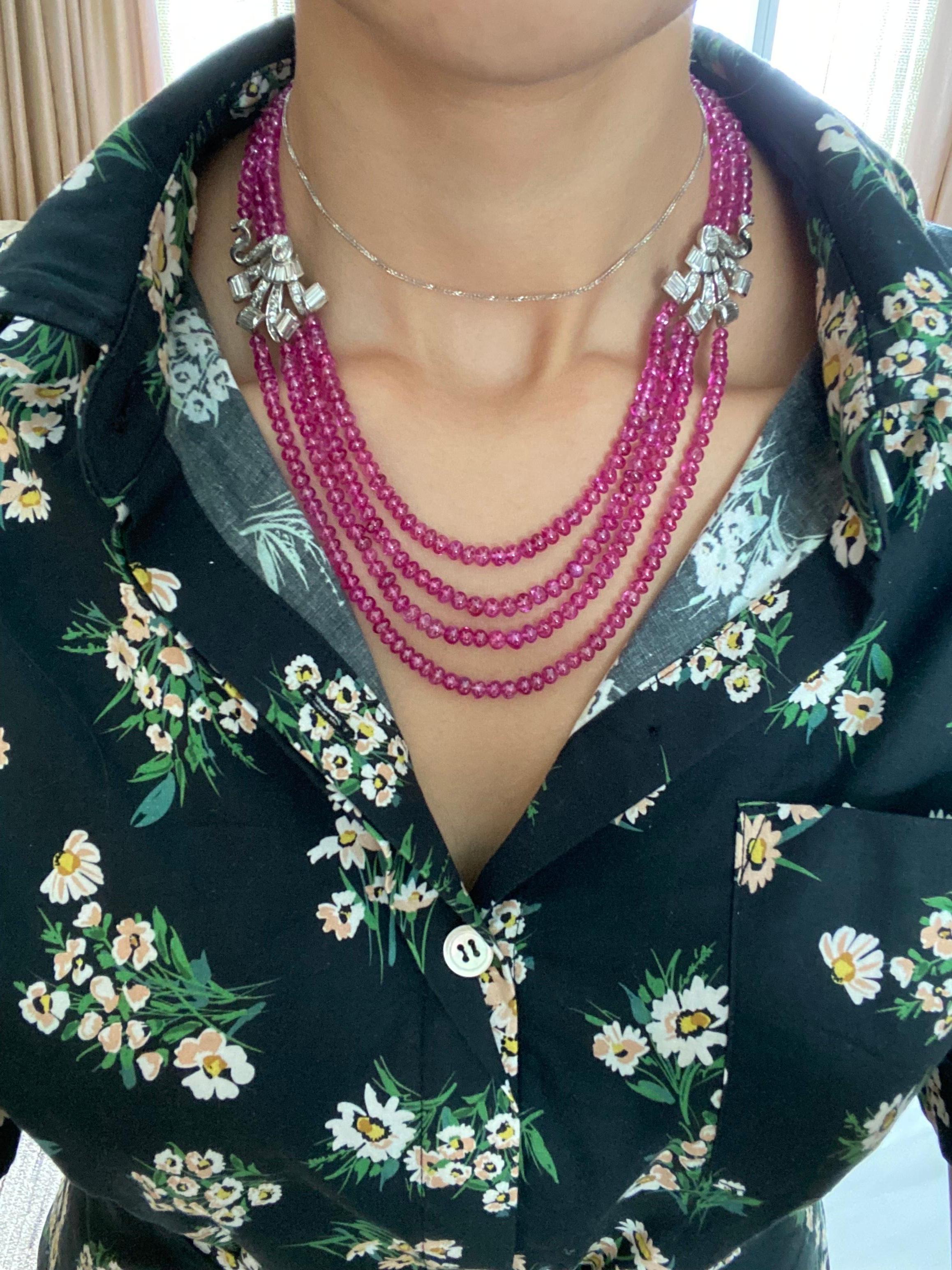 A beautiful, art-deco 296 carat no-heat, Burmese Ruby beaded necklace with 7.25carat Diamond and 18K gold side pieces. The beads are transparent with great luster, with an ideal pinkish-red hue, making it a one of a kind statement necklace! 
We