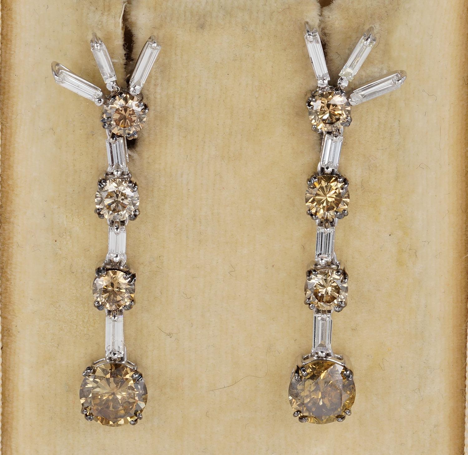 An extraordinary pair of natural Fancy Coloured Diamond drop earrings dating 50's.
Diamonds come in many colours,these are of amazing cinnamon or orange Brown all natural and excellent in cut to catch and project the best of natural sparkle all