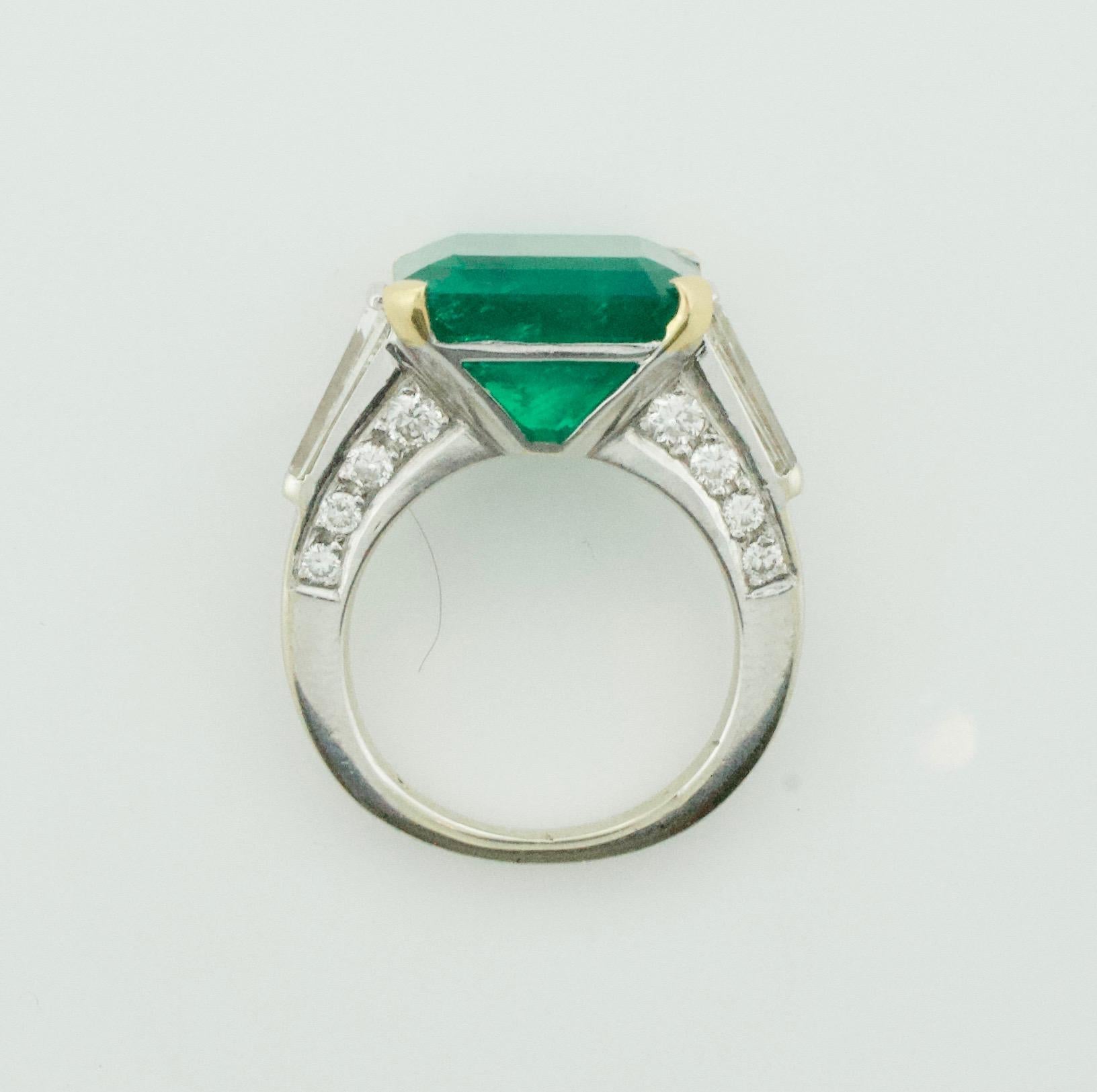 
Stunning Platinum Emerald/Diamond Ring, meticulously crafted to exude elegance and sophistication. This captivating piece features:

🔹 1 Emerald Cut Emerald: An awe-inspiring 9.18ct emerald, radiating unparalleled beauty and grace, certified by