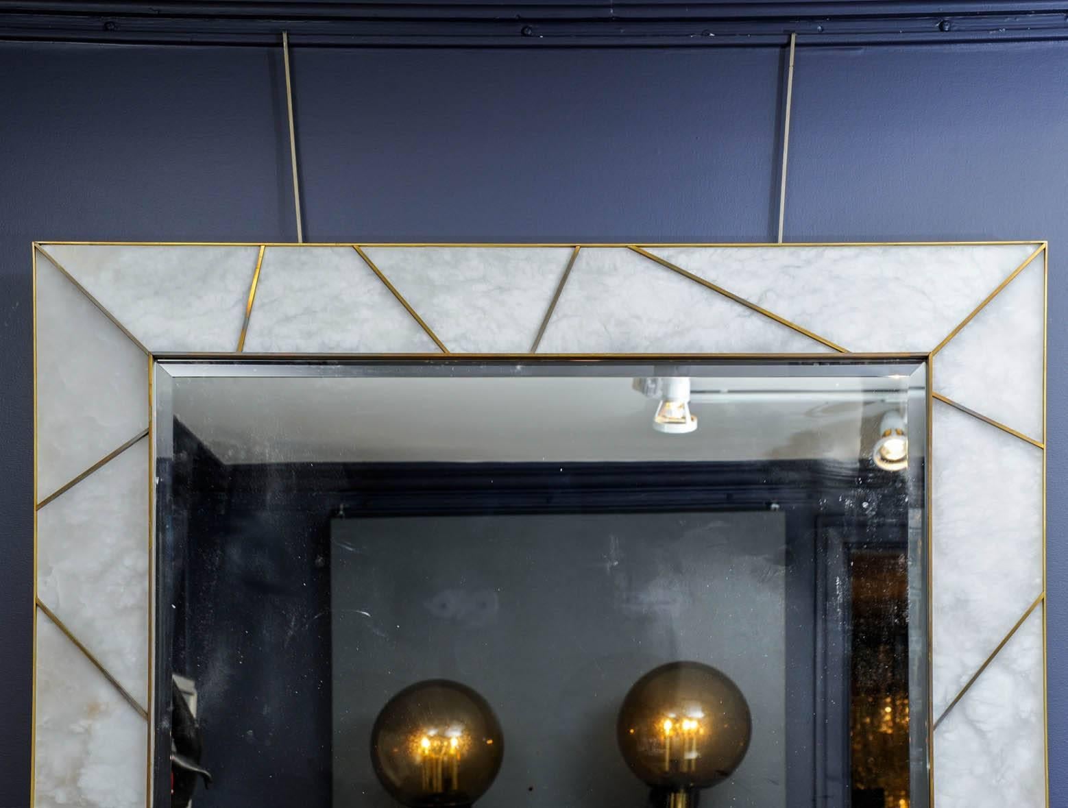 Important mirror framed with alabaster and brass framework. Studio Glustin original creation. A pair is available.