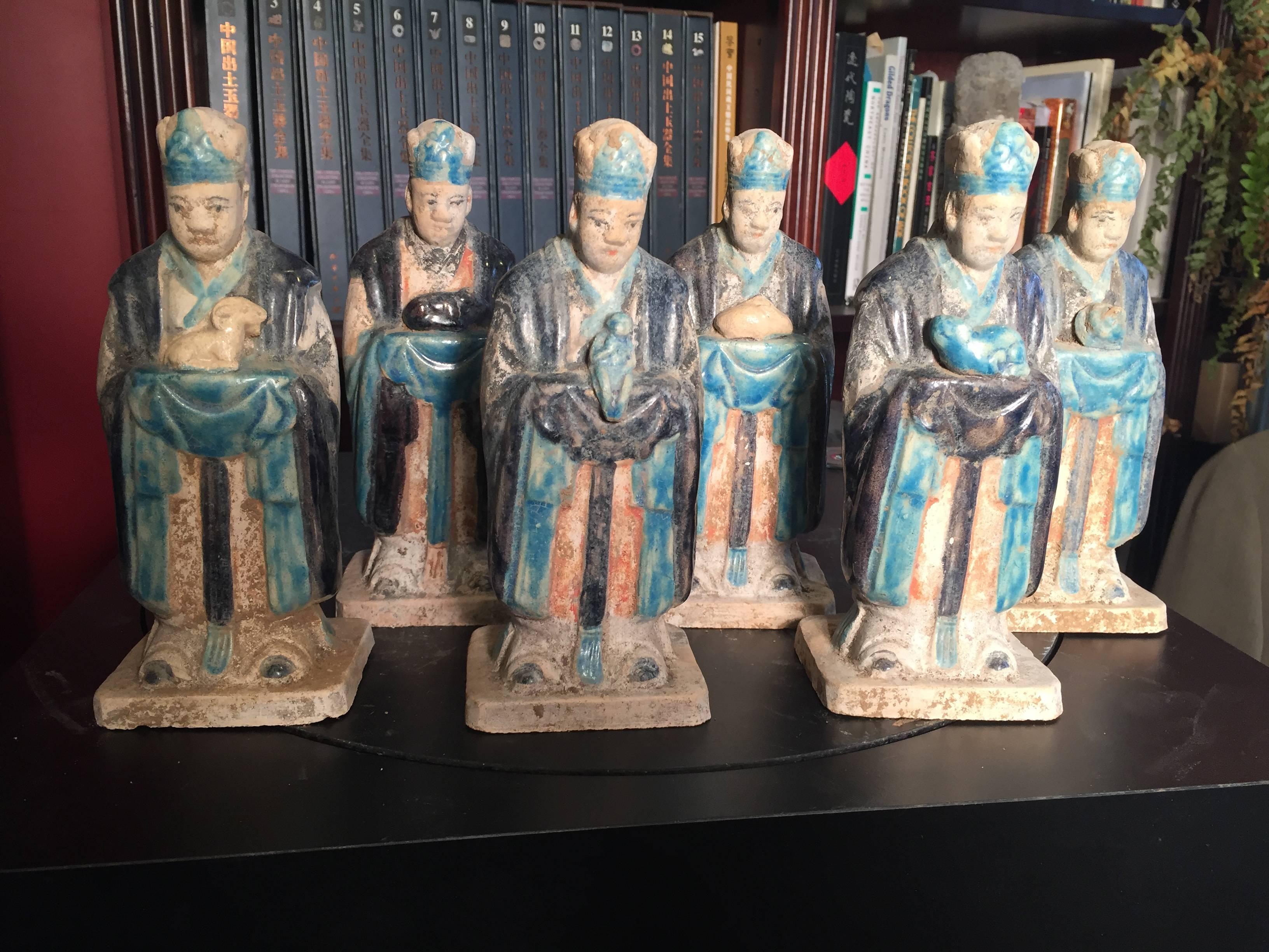 Important ancient Chinese Zodiac complete collection twelve (12) figures each holding a zodiac attribute, Ming Dynasty 1368-1644. Superb quality.

Each of these twelve (12) tomb figures holds a different animal from the zodiac. Twelve (12) Zodiacs