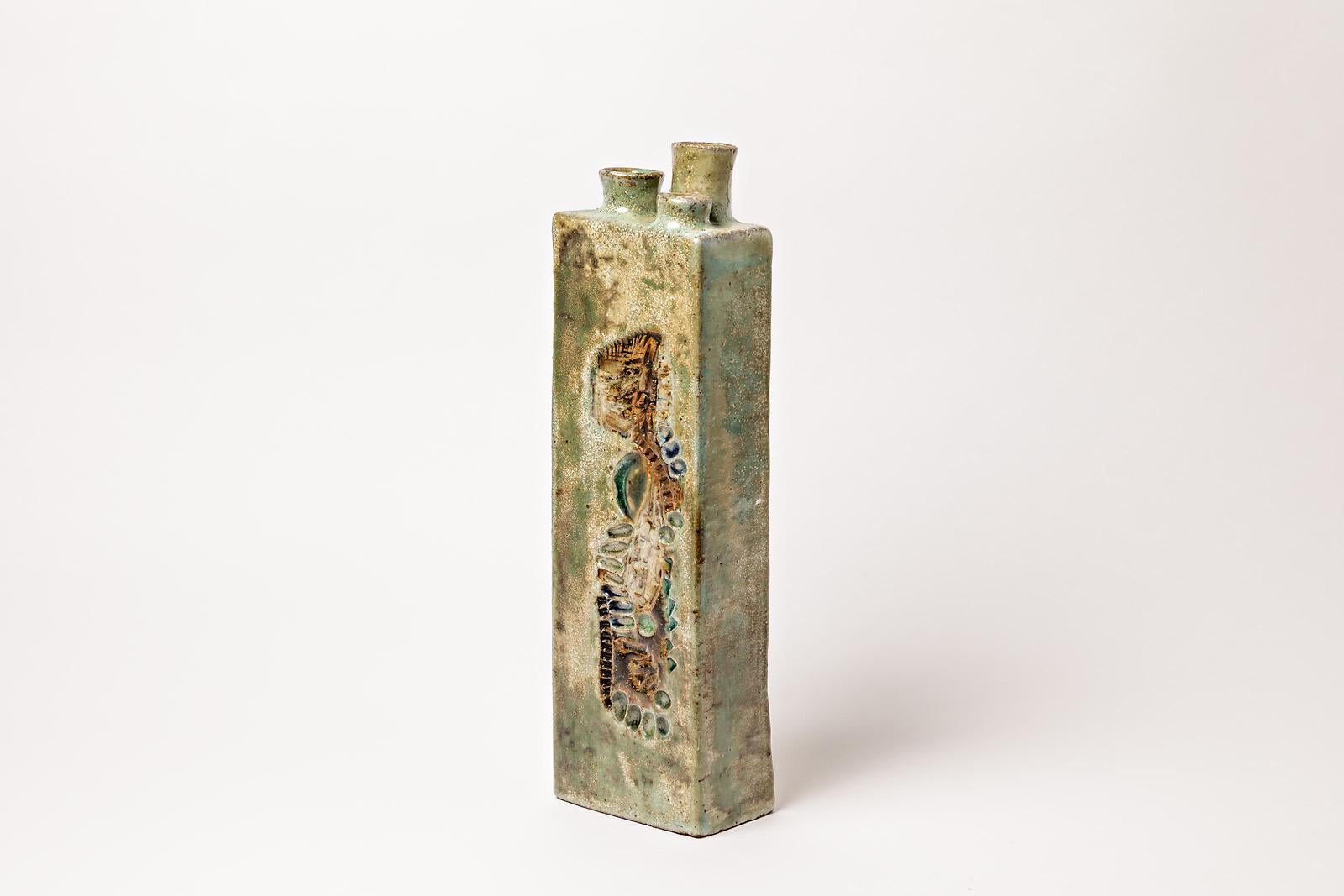 Annie Maume

Important and sculptural 20th midcentury stoneware ceramic vase by the French artist.

Elegant green colors and abstract decoration.

Signed under the base

Perfect condition

Dimensions: 39 x 11 x 7cm.