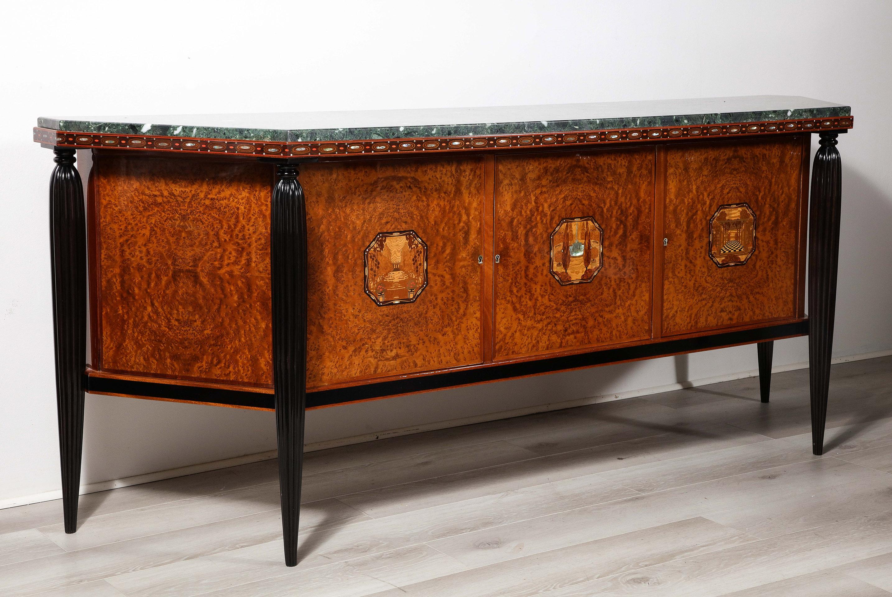 A superb example of early Art Deco Design by Maurice Dufrene. The burr walnut canted sideboard supporting a marble top, which is 