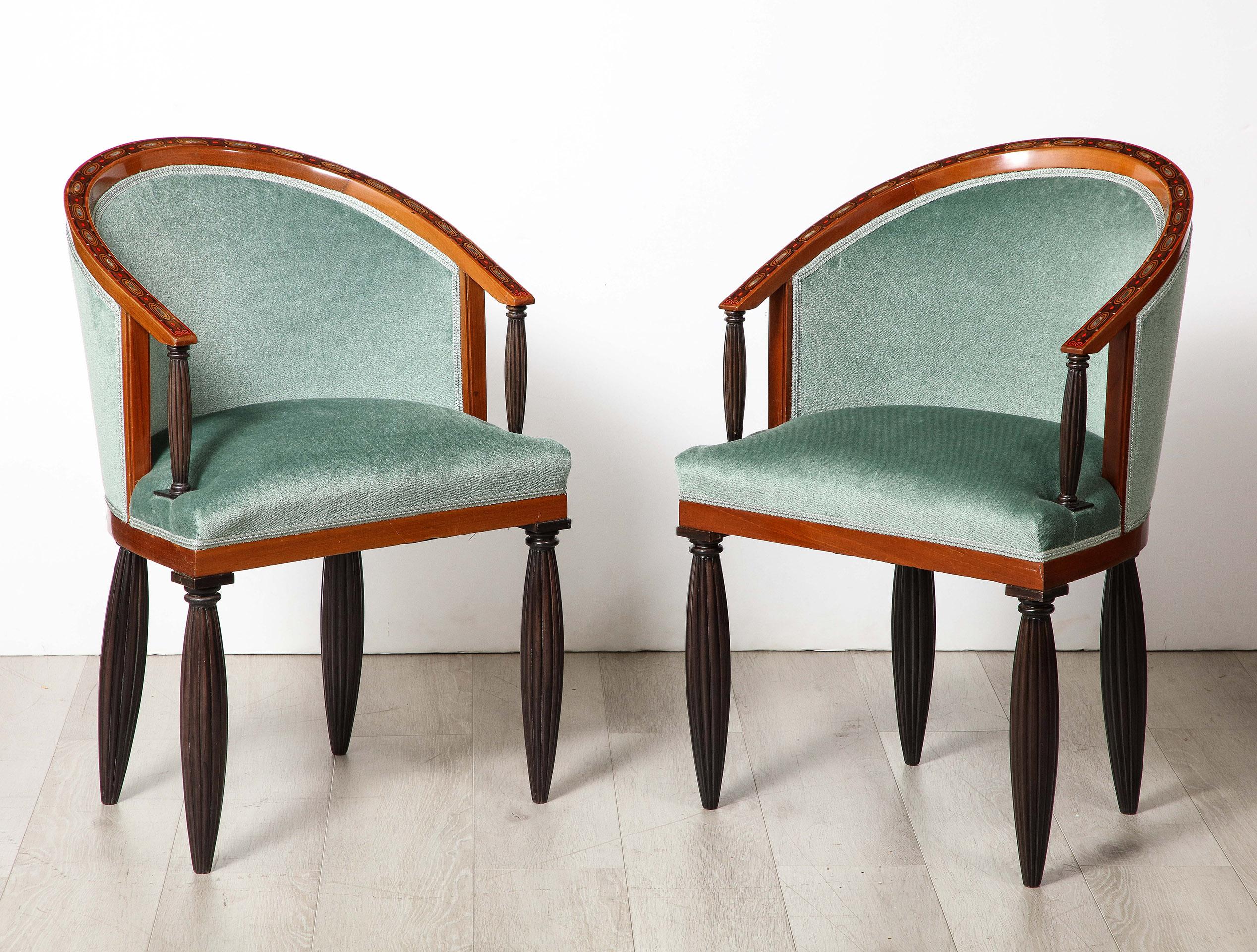 A superb example of early Art Deco Design by Maurice Dufrene. Each of the eight (8) dining chairs is constructed a frame intricately inlaid with  fruit wood and Mother-of-Pearl. The frame inset with Rosewood fluted columns and supported by 4