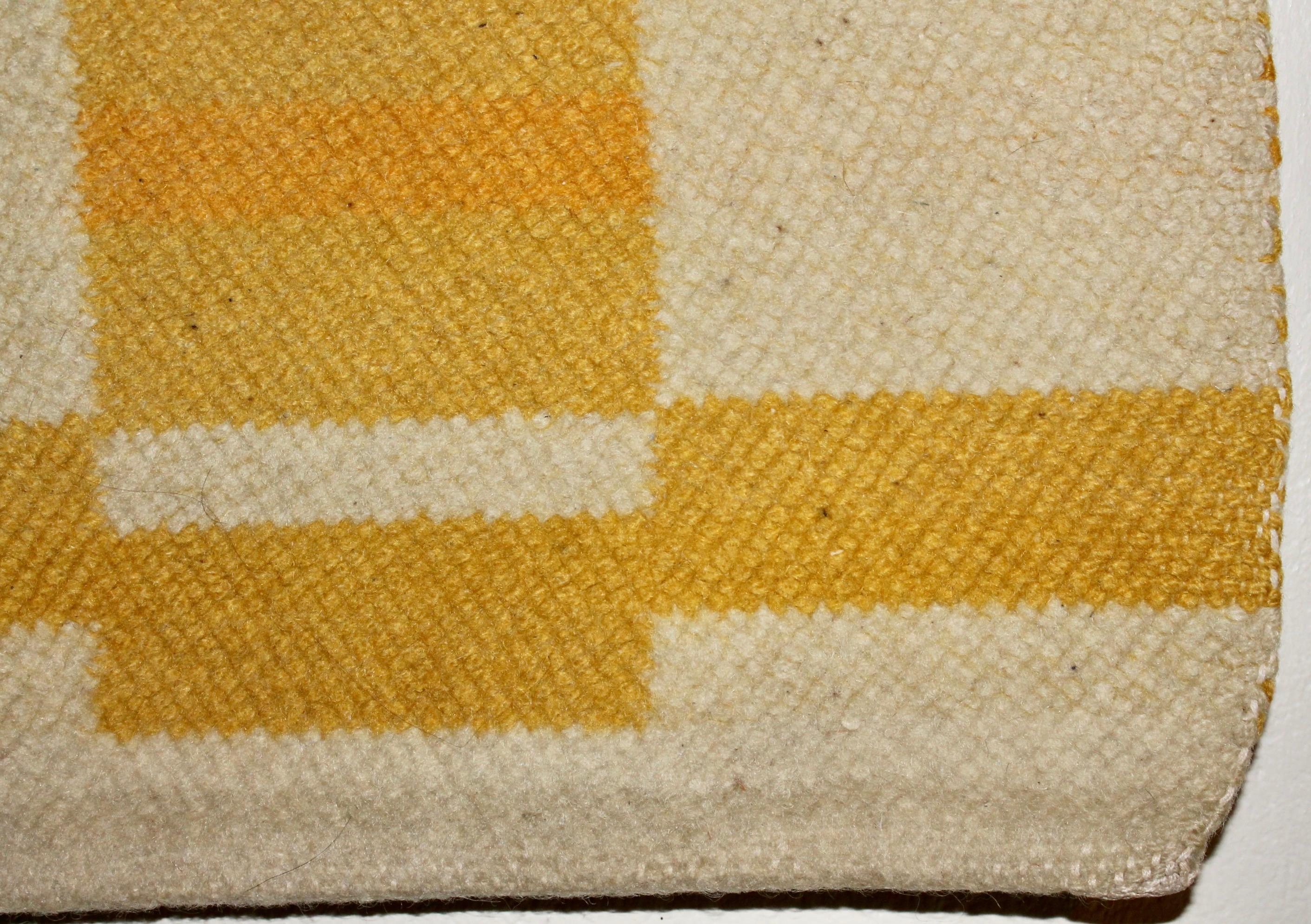 A period hand woven horizontal rectangles in two yellows and off white in a strict 'implied verticals' geometric Bauhaus or Black Mountain Design. Approximately 26 x 25.75 x 3/8