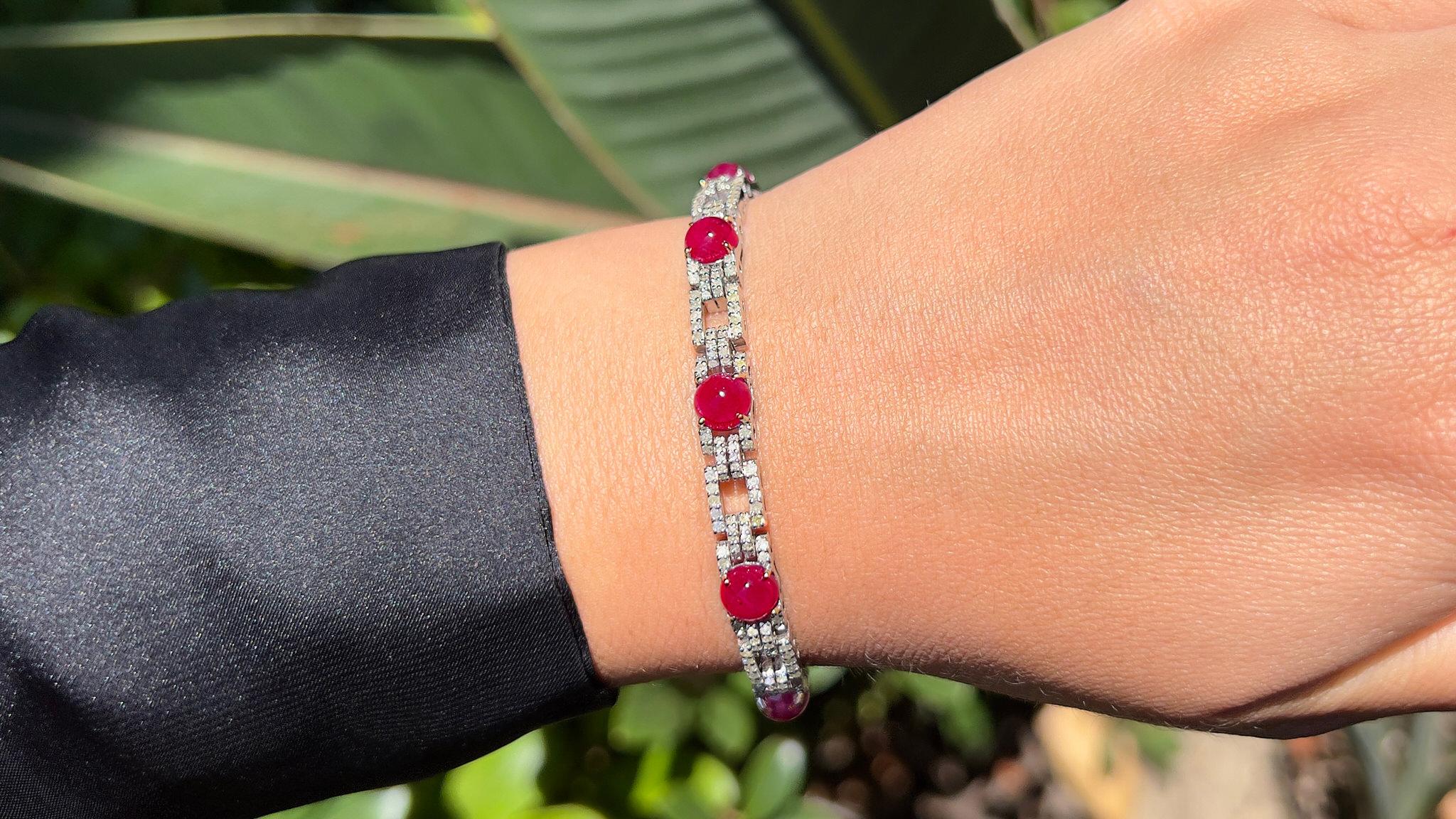 It comes with the Gemological Appraisal by GIA GG/AJP
All Gemstones are Natural
Rubies = 13.38 Carats
Cut: Cabochon
Diamonds = 4.65 Carats
Color: H-M, Clarity: VS-SI
Metal: 14K Gold & Silver
Bracelet Length: 7 Inches