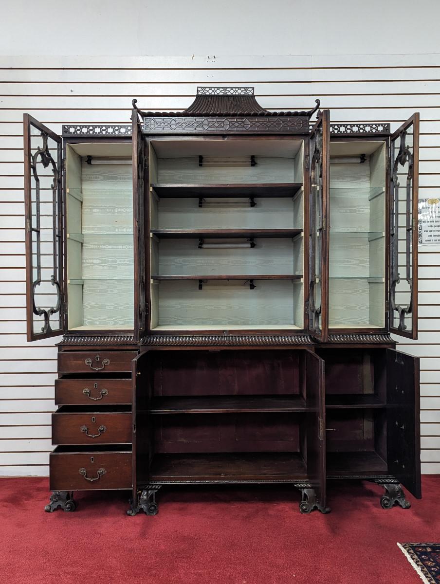 What a rare find! Definitely a conversation piece, Second half 19th century, From the Aesthetic Movement period, Solid Mahogany, Chinese Chippendale Style, Fretwork around top edge on both sides, Pagoda at top center, pagoda has fretwork and carved