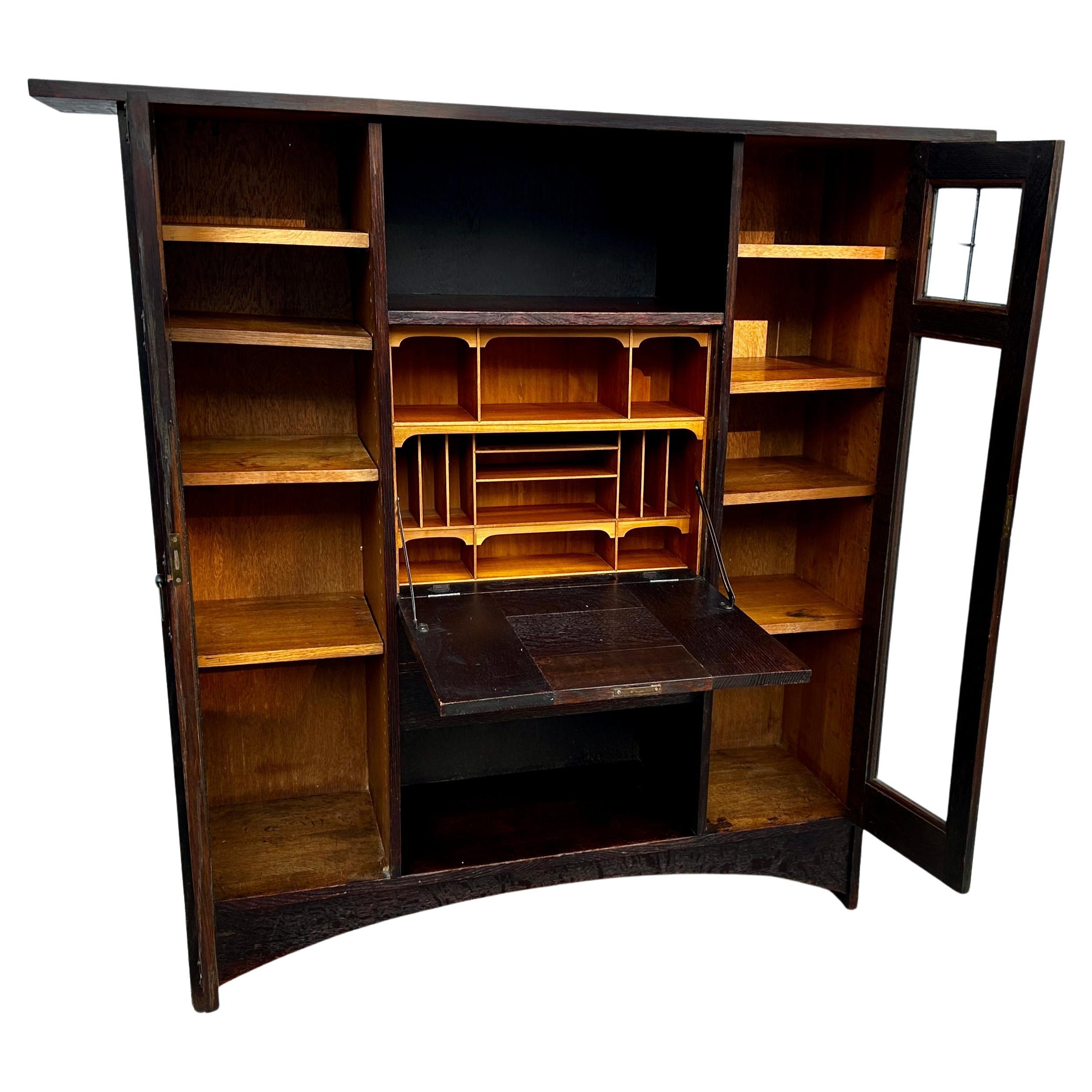 This is an extremely important Antique Desk/Bookcase by Gustav Stickley and Harvey Ellis.  This is one of the most important pieces made by Gustav Stickley.  It was designed  in 1902 by Harvey Ellis just before  he died.  The piece is in excellent