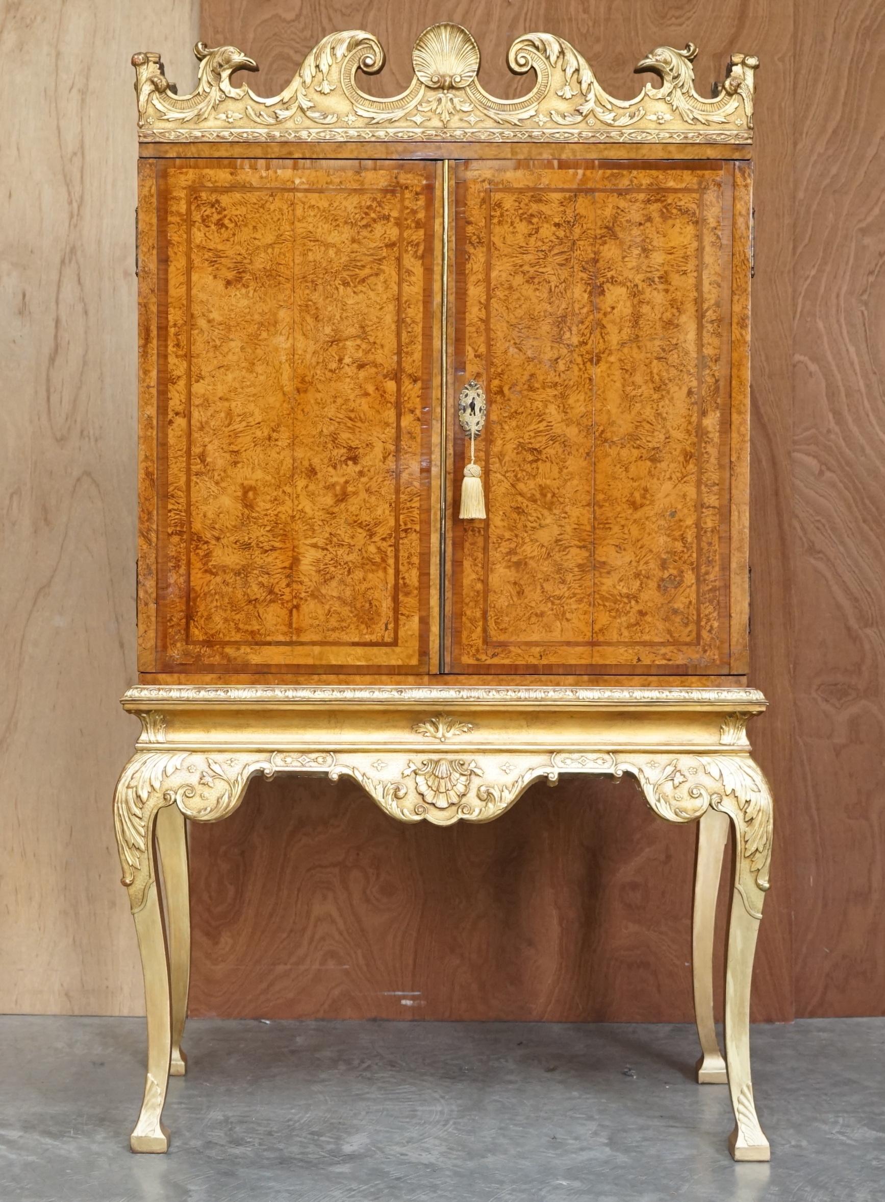 We are delighted to offer for sale this absolutely exquisite and important antique George II circa 1740 Mulberry wood drinks cabinets depicting eagles heads with original giltwood finish

What a piece! This is pure art furniture from every angle,