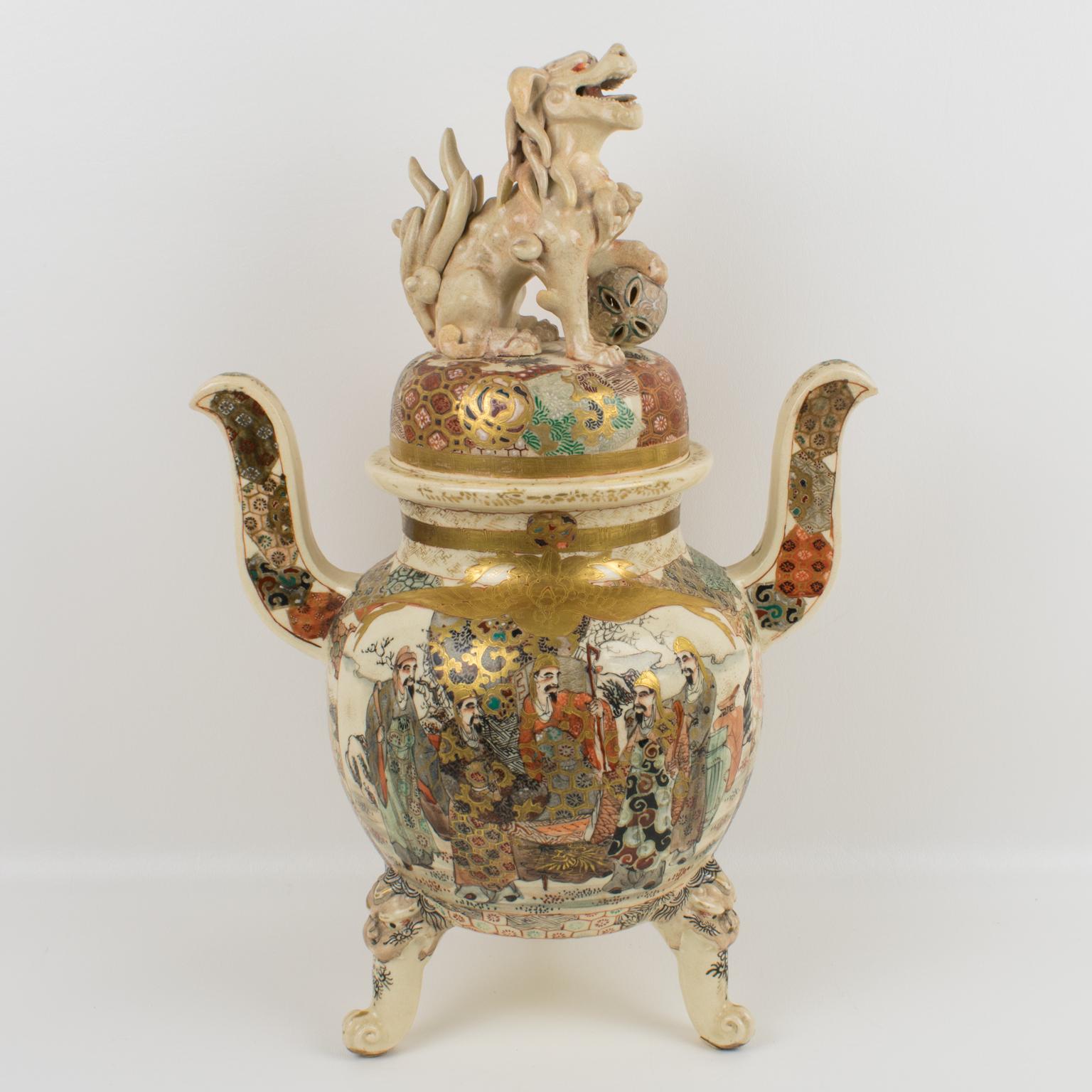 We present an exceptional Satsuma porcelain urn or covered vase from the Japanese Meiji era (1868-1912). Its splendor and uniqueness are undeniable. The lidded jar is richly decorated with enamel and hand-painted Lohan scenes with gilt accents and