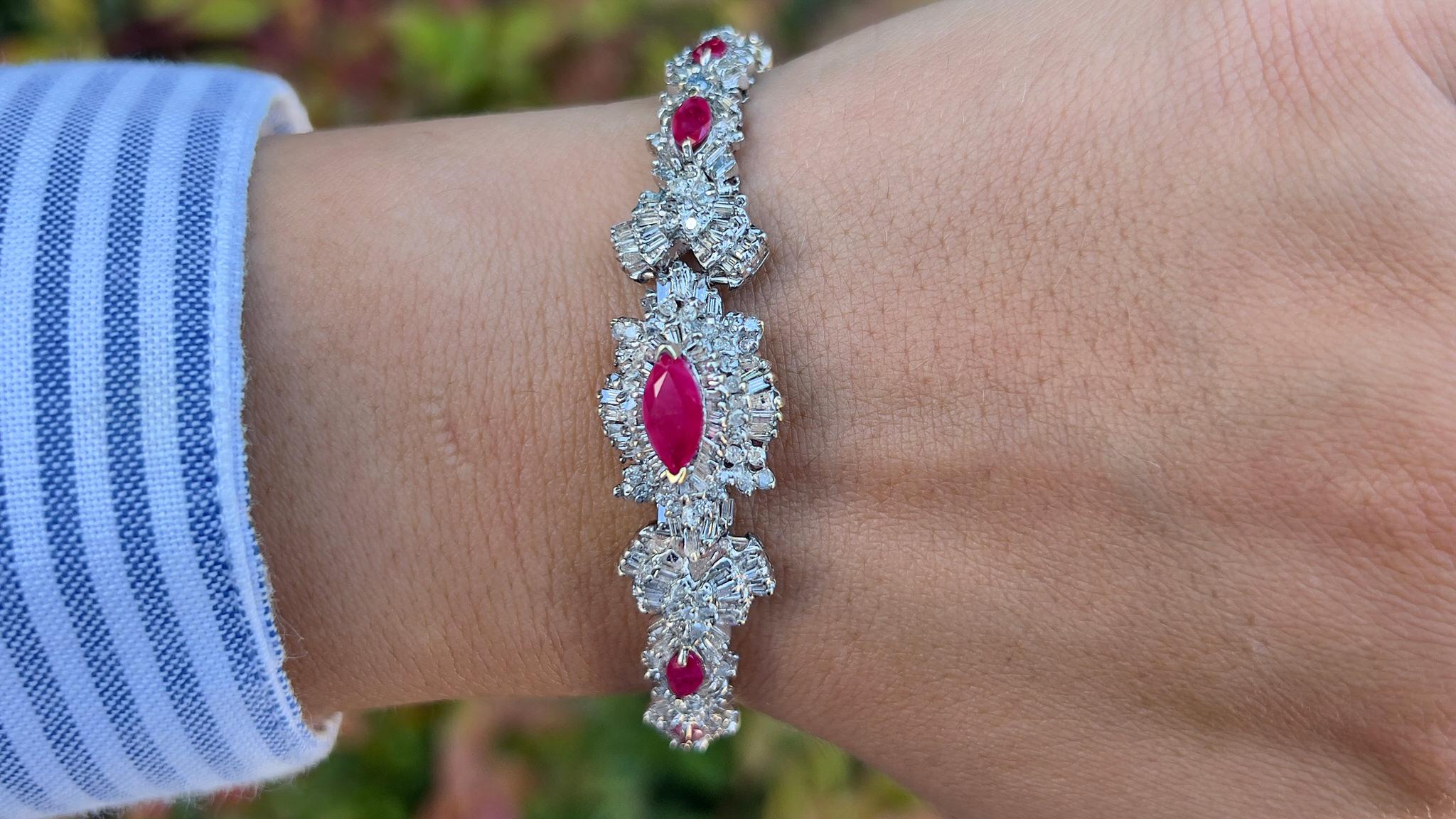 It comes with the Gemological Appraisal by GIA GG/AJP
All Gemstones are Natural
Rubies = 5.28 Carats
Cut: Marquise
Diamonds = 6.82 Carats
Color: F-H, Clarity: VVS-SI
Metal: 14K White Gold
Bracelet Length: 7 Inches