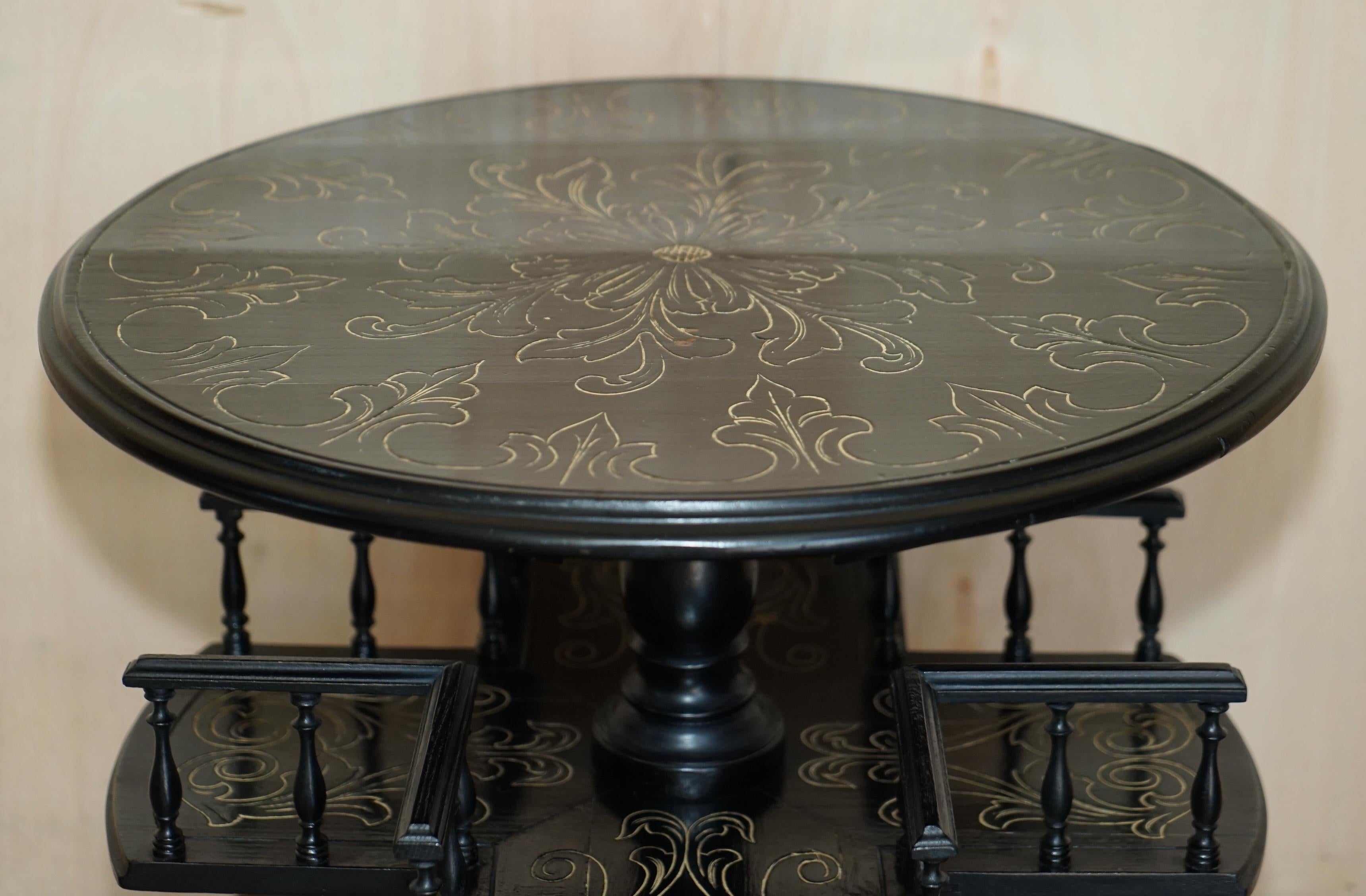 We are delighted to offer for sale this very rare, Victorian circa 1880 Chinese Chinoiserie revolving bookcase table.

An exceptionally well made and highly decorative library book table, it is a twin tier table both levels revolve, ebonised and