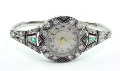Important Art Deco Black, Starr, and Frost Platinum Diamond Emerald Wristwatch