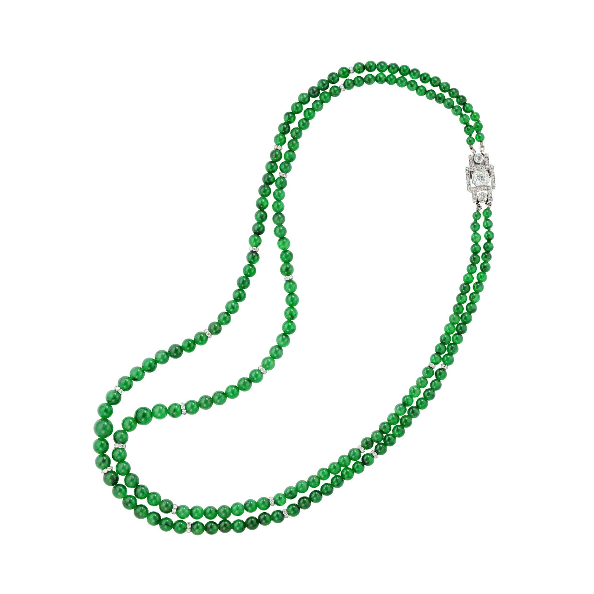 An Important jade and diamond double strand necklace, the hundred-ninety-two jadeite jade beads, accompanied by GCS Report 77111-81 stating to be natural with no indication of impregnation and approximate weight 210 carats, graduating from the