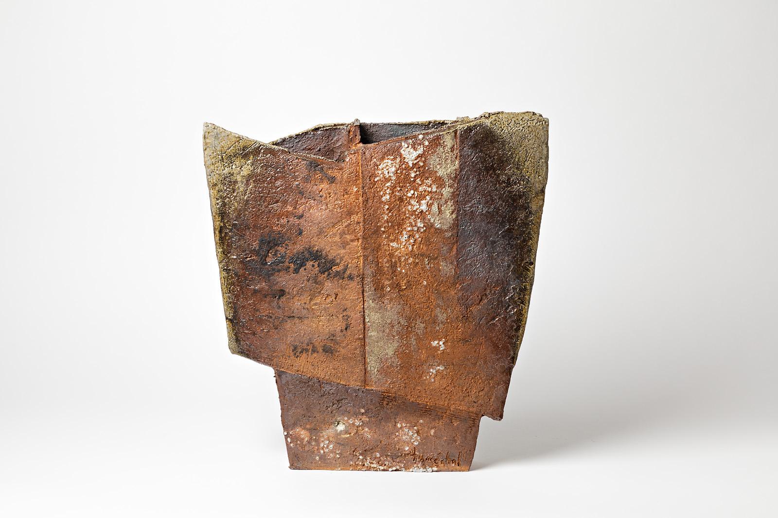 F Marechal

Important and massive asymmetric sculptural vase.

This imposant stoneware ceramic is very decorative with geometrical form and stoneware ceramic effect.

Beautiful colors with brown and black firing effects.

Signed at the base