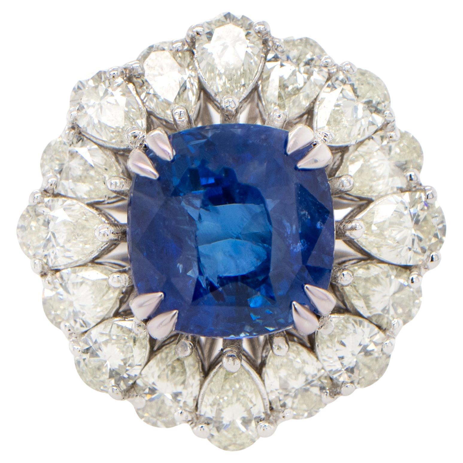 Importante bague en or 18 carats avec saphir bleu et halo de diamants poire de 9,85 carats