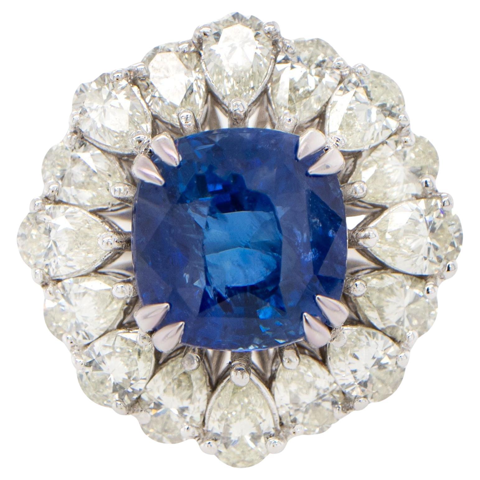 Important Blue Sapphire Ring With Pear Diamond Halo 9.85 Carats 18K Gold For Sale