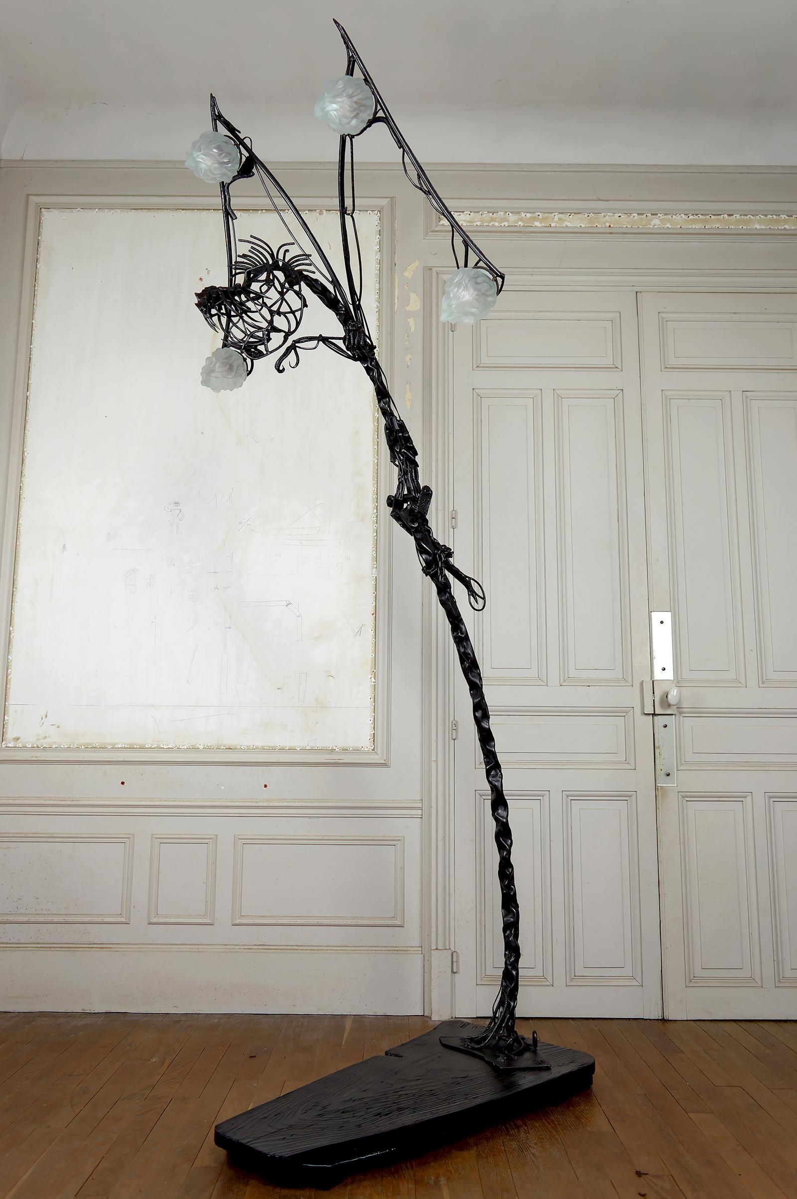 We are thrilled to present this exceptional floor lamp, a unique and genuine masterpiece of Brutalist design, made of wrought iron and originating from France. 

This imposing piece is a true functional sculpture, combining art and utility with raw,