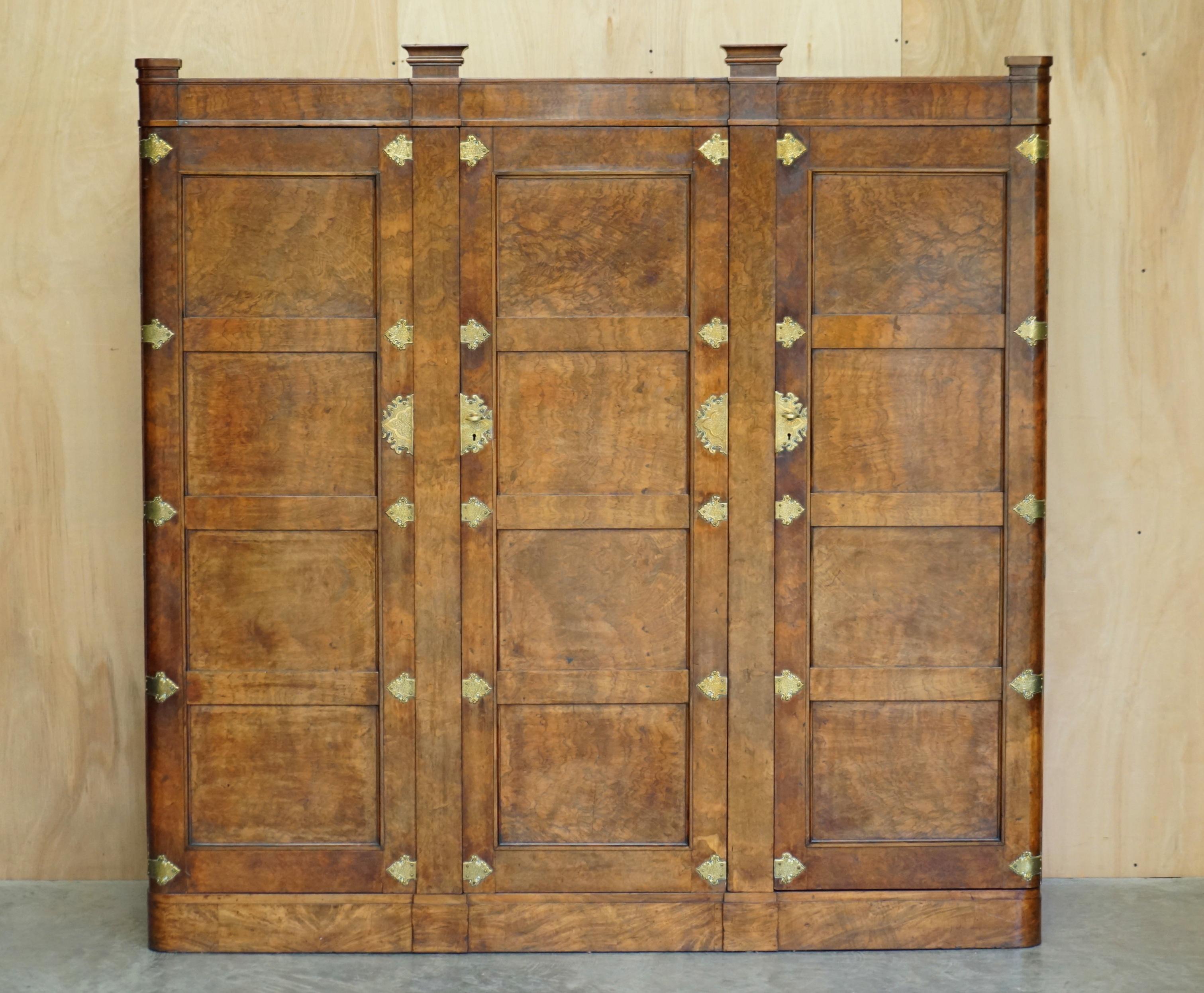We are delighted to offer for sale this very rare and important, Museum quality, Gothic style Antique Burr & Burl Walnut wardrobe with oversized, polished brass fittings

This piece is part of a suite, I have the matching dressing table listed
