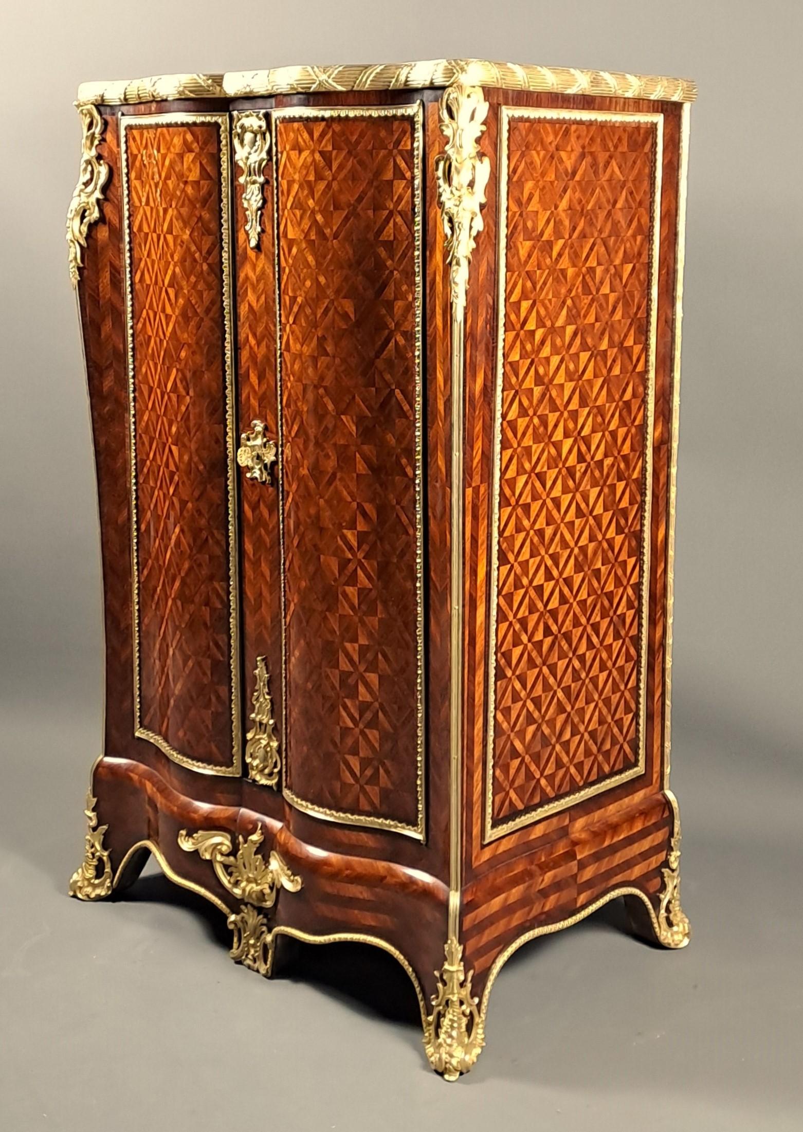 Louis-Auguste Alfred Beurdeley (1808-1883) and his son Alfred-Emmanuel Beurdeley (1847-1919)

Cabinet forming a small cupboard in the Louis XV style in geometric marquetry composed of diamonds and chevrons made of rosewood and mahogany, all