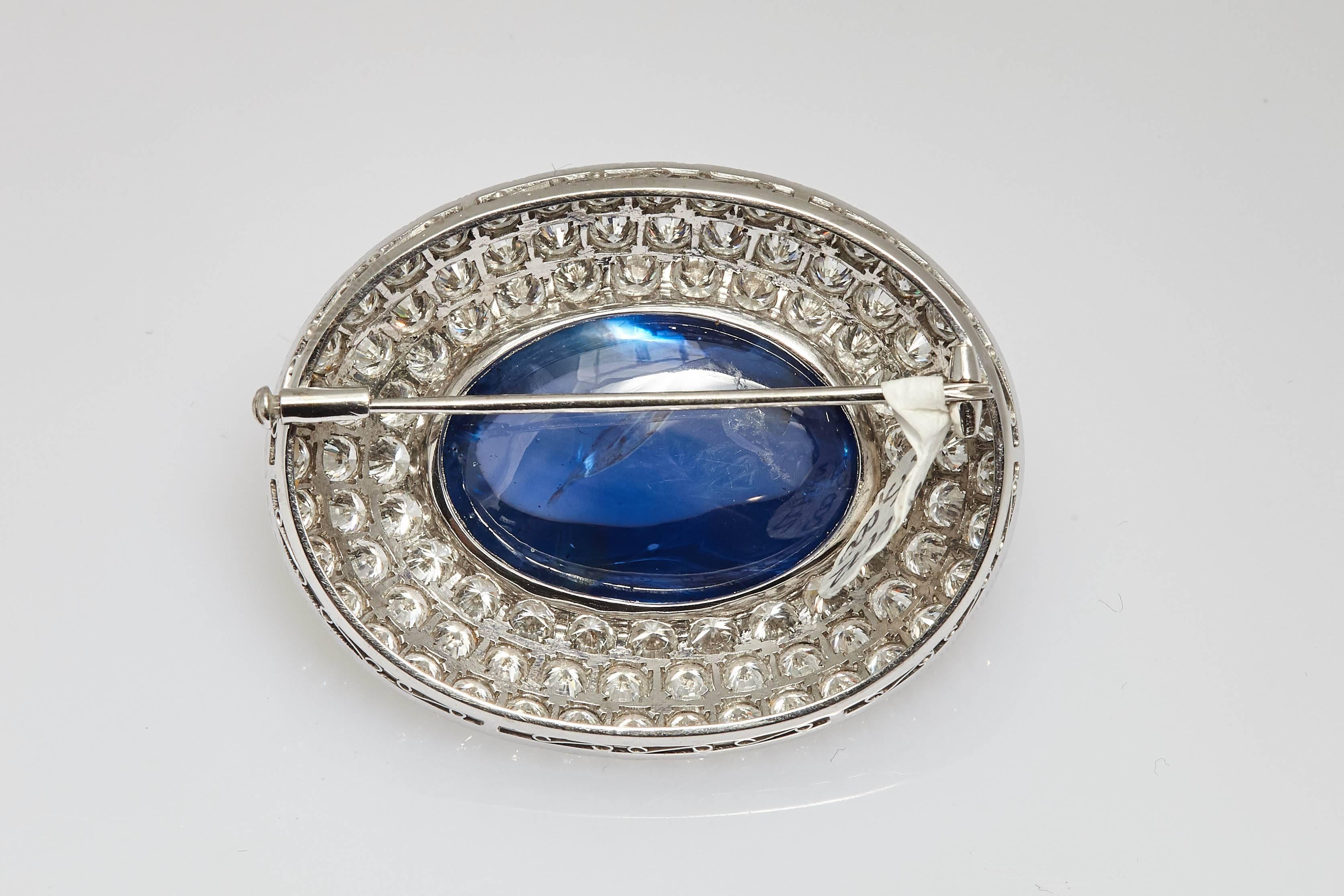 An important diamond and natural (no heat/treat) Ceylon sapphire brooch, mounted on 18kt white gold. The sapphire weighs approx 60cts. Made in Italy, circa 1965.