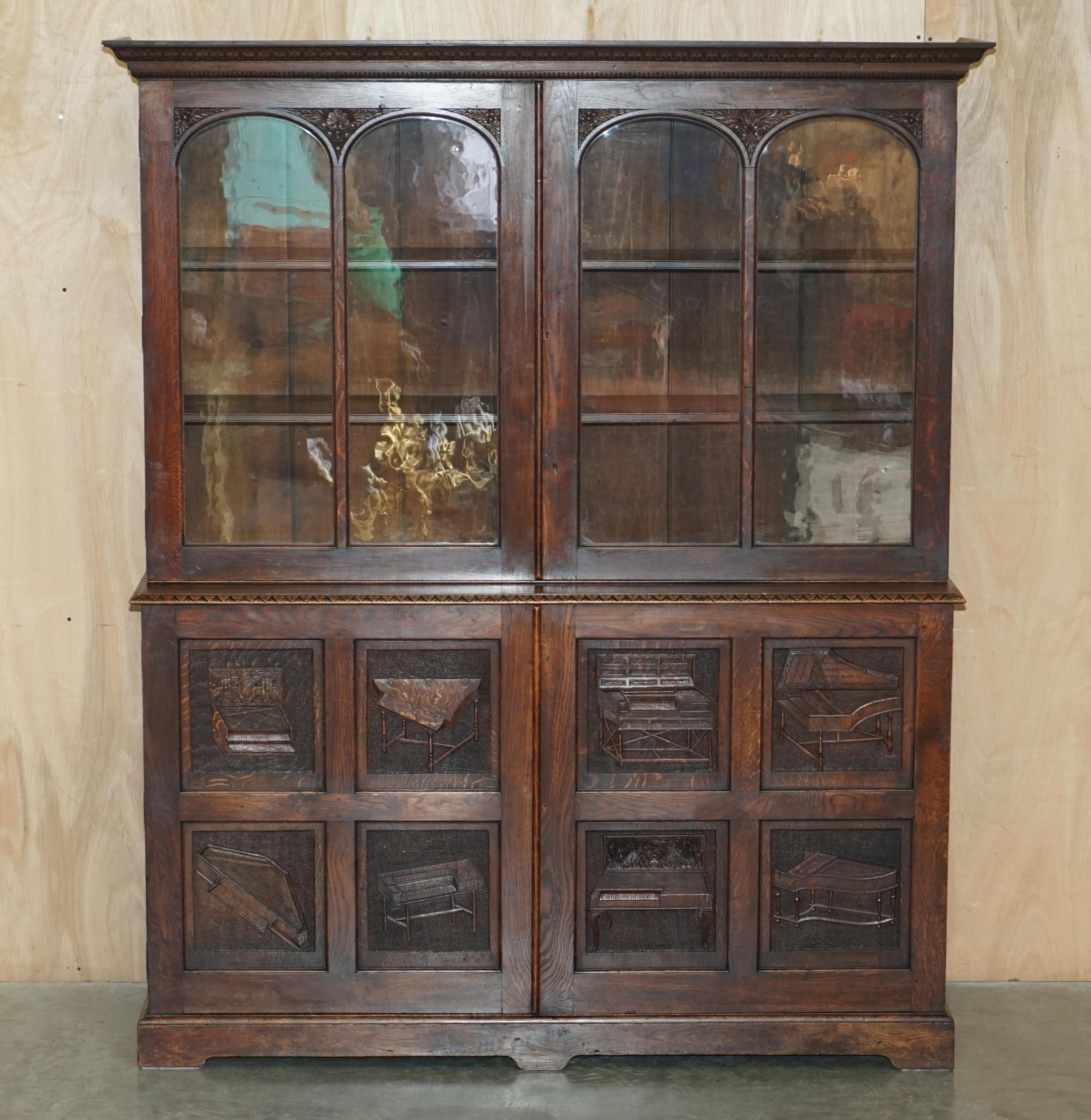 Royal House Antiques

Royal House Antiques is delighted to offer for sale this absolutely exquisite hand carved with Musical instruments, library bookcase cabinet, made for Charles Taphouse of Oxford Music & Instrument Shop, then owned by the Oxford
