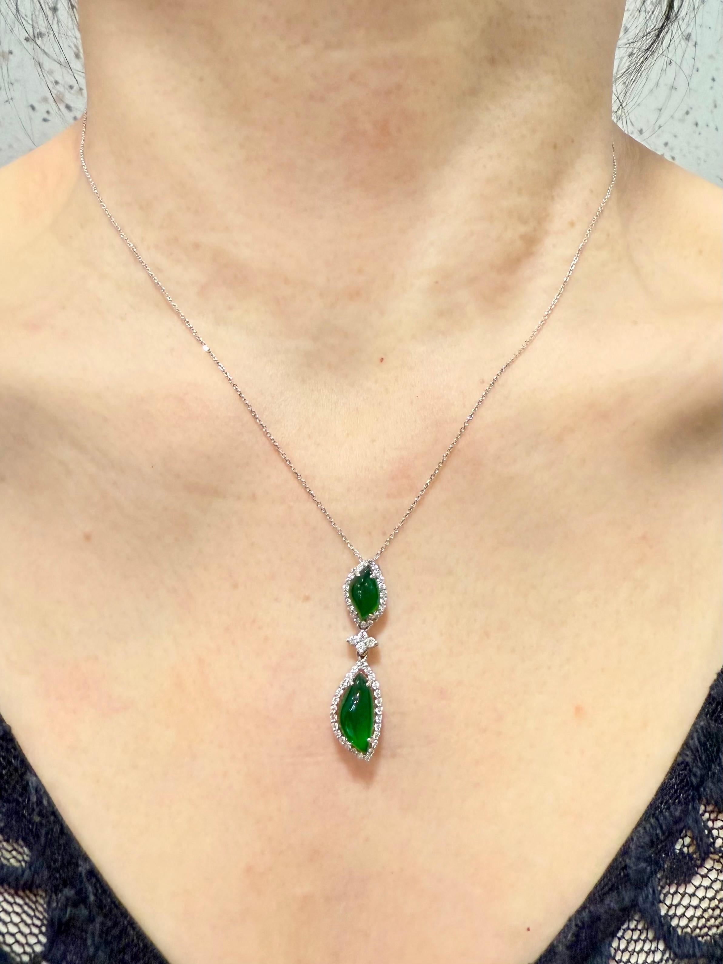 Please check out the HD video. Here is a natural imperial Jadeite Jade and diamond pendant with the best imperial green color. This color is rare because it exhibits a strong saturation of green combine with high translucency. Almost ALL jades of