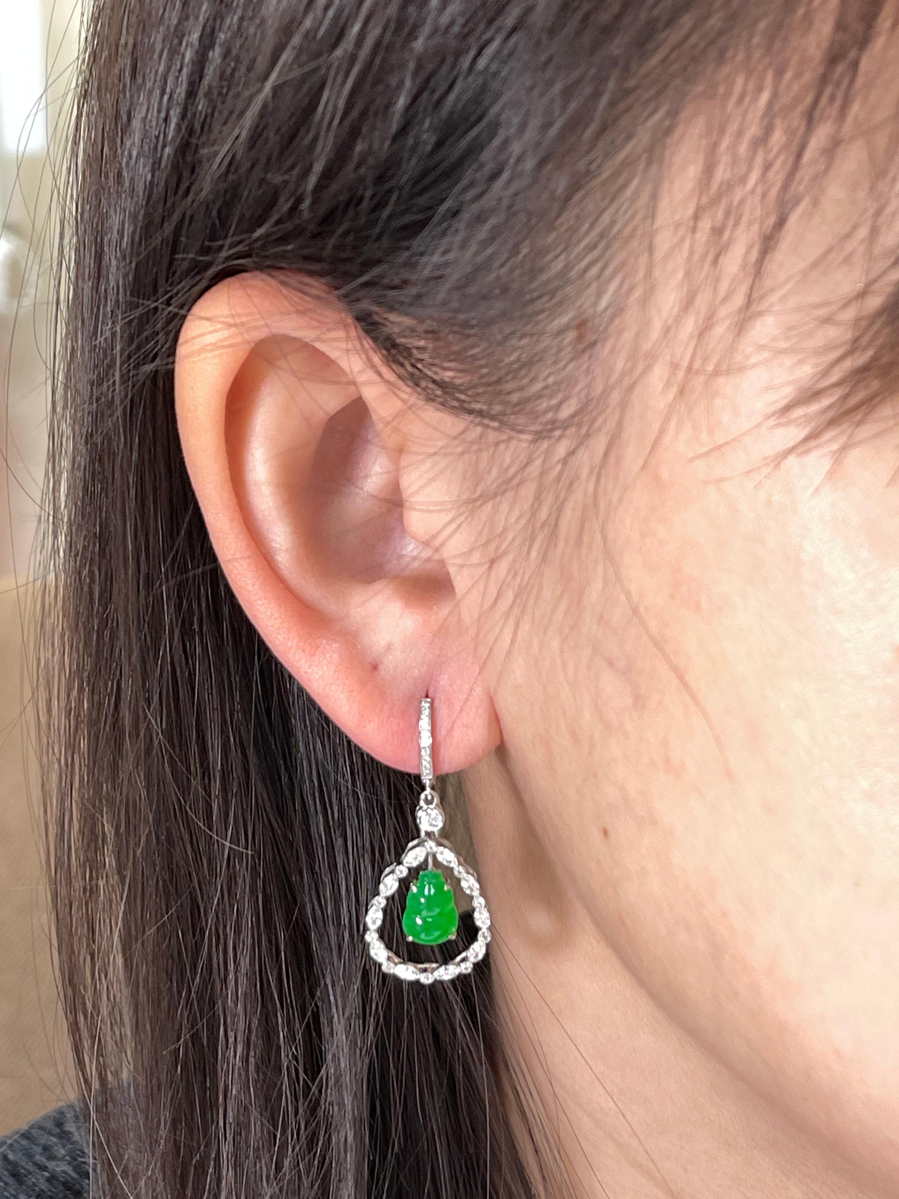 Here is a pair of natural imperial Jadeite Jade and diamond earrings with the best imperial green color. This color is rare and in high demand. It is certified by 2 different labs. The jade gourd represents the Fulu double, it protects peoples