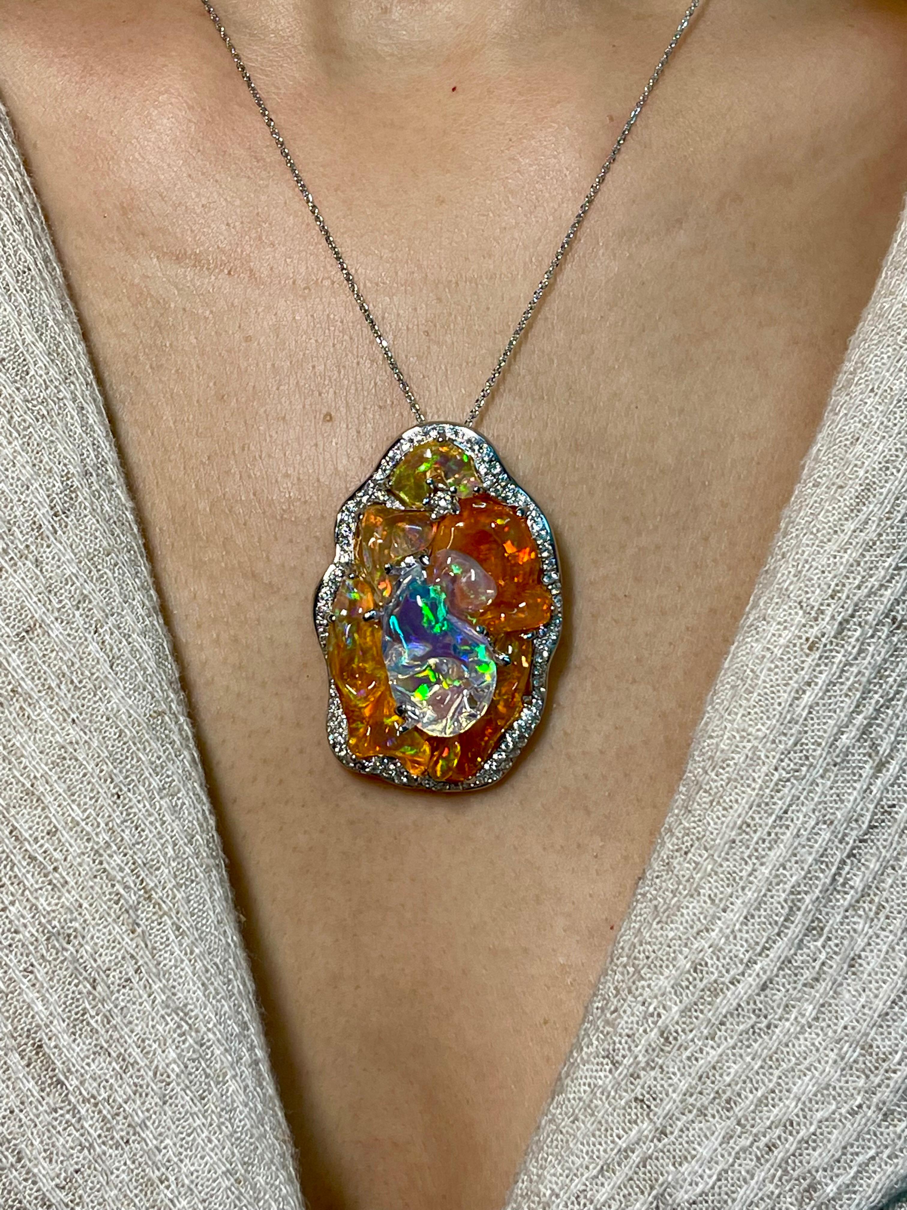 Please check out the HD video! This is an important and substantial piece! 6 pieces of top gem quality opals make up this large pendant. Here is a natural Mexican fire opal and diamond pendant with superb play of color. The natural opals in this