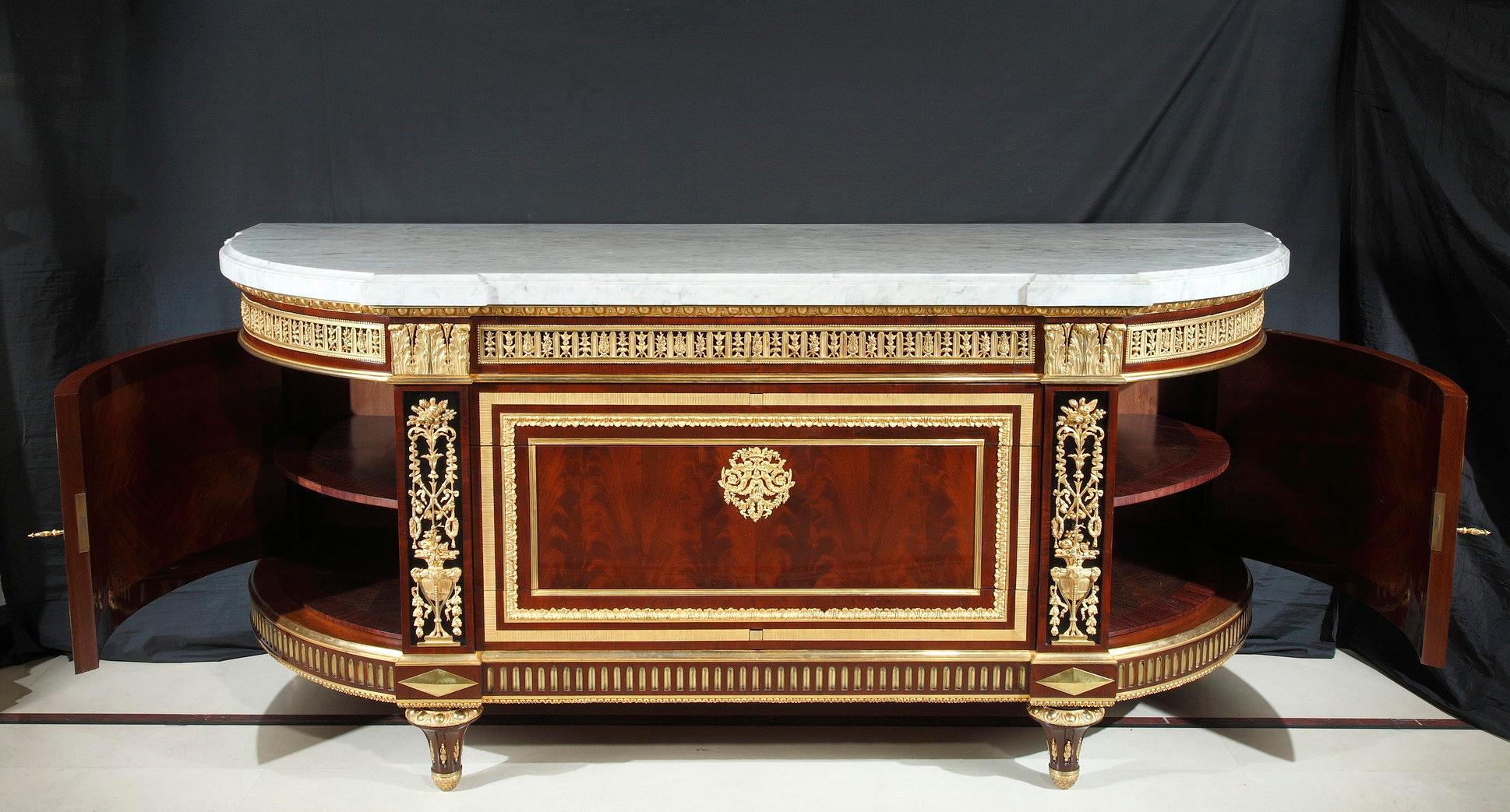 Very important chest-of-drawers in veneered and darkened wood. Rich and fine ornamentation made of Louis XVI style gilded and chiseled bronze representing egg-and-dart and foliage friezes. Opening by four drawers, one in the belt, two hidden with a