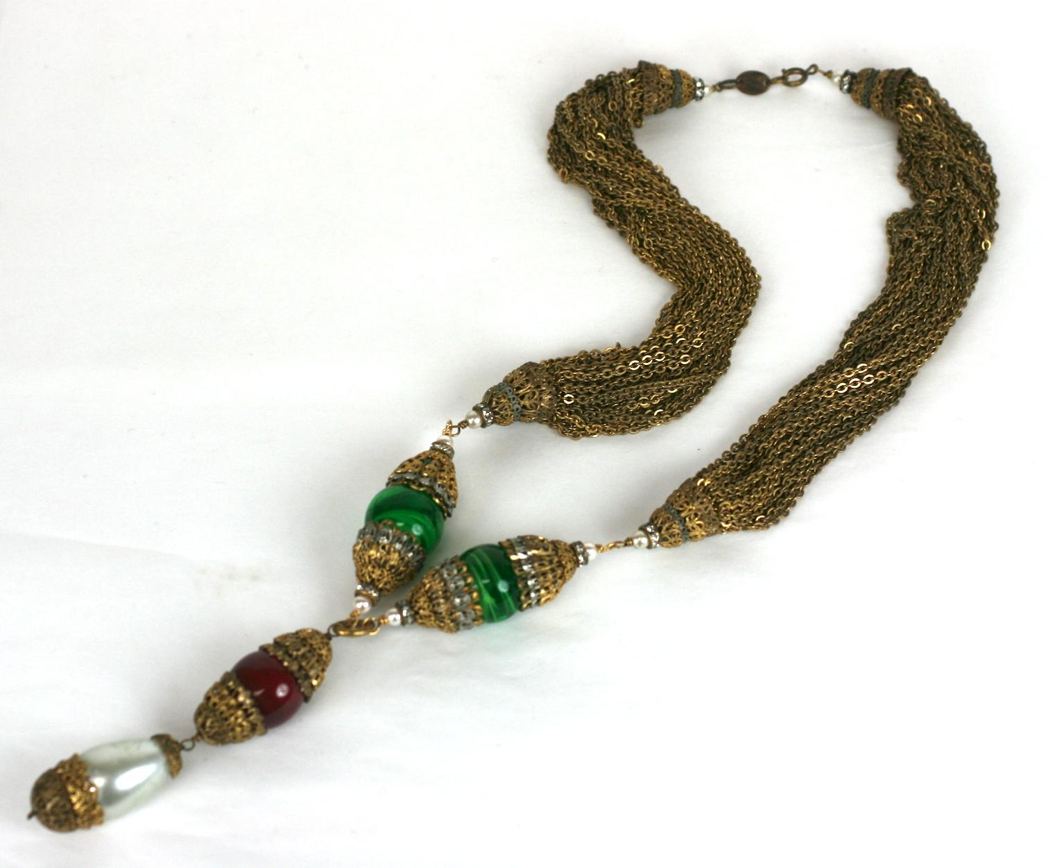 Extraordinary, early Coco Chanel Haute Couture Sautoir by Robert Goossens, Paris circa 1960. Handmade pate de verre beads in emerald and ruby are combined with dozens of gilt and silvered filigree caps, crystal rondels, faux pearls and multi chain