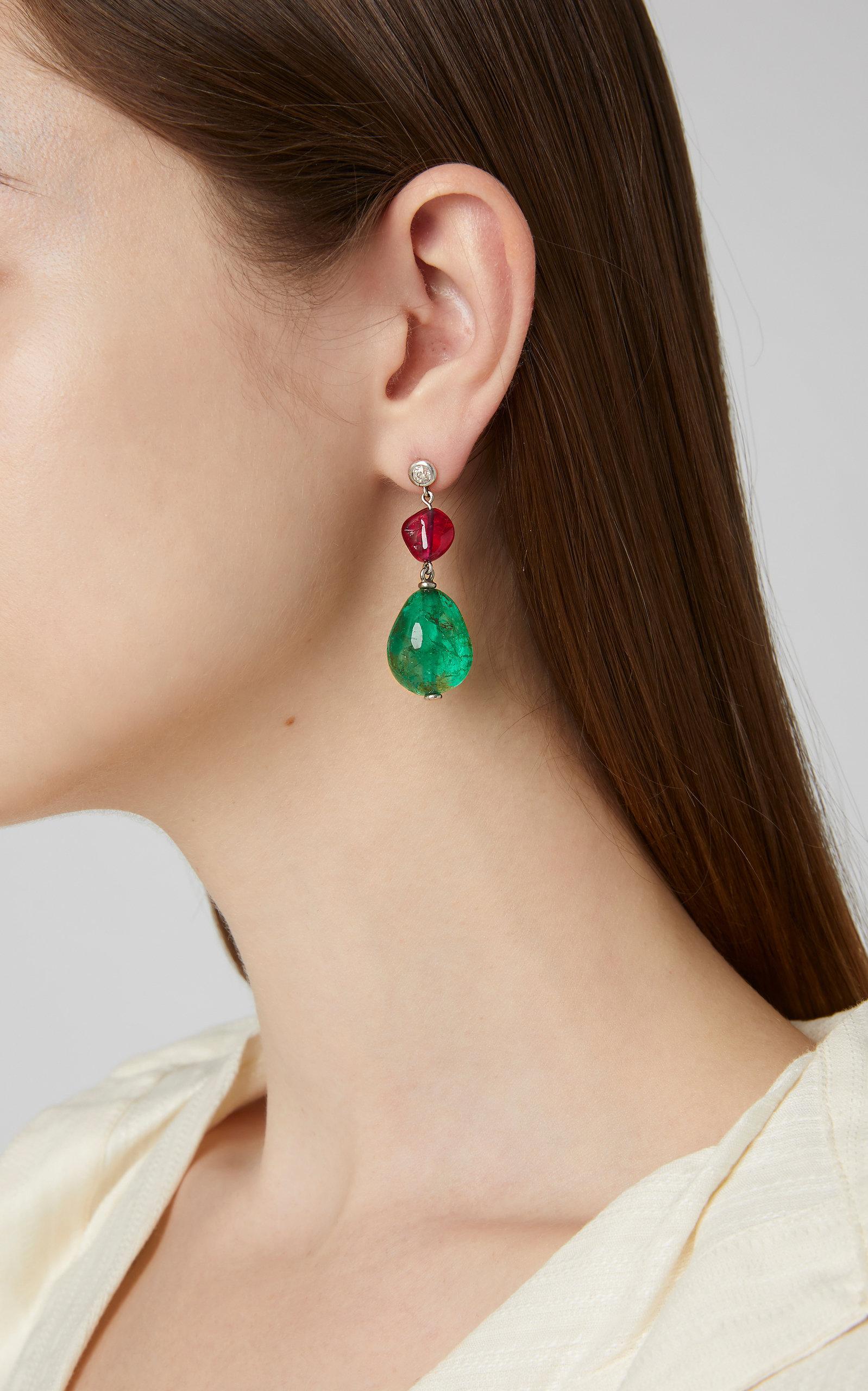 An important pair of ear pendants suspending two old mine Colombian emerald beads from the 19th century (31 cts and 25 cts), spinels (13 cts total) and old mine cut diamonds. Mounted on 18kt white gold. Created by Eleuteri 