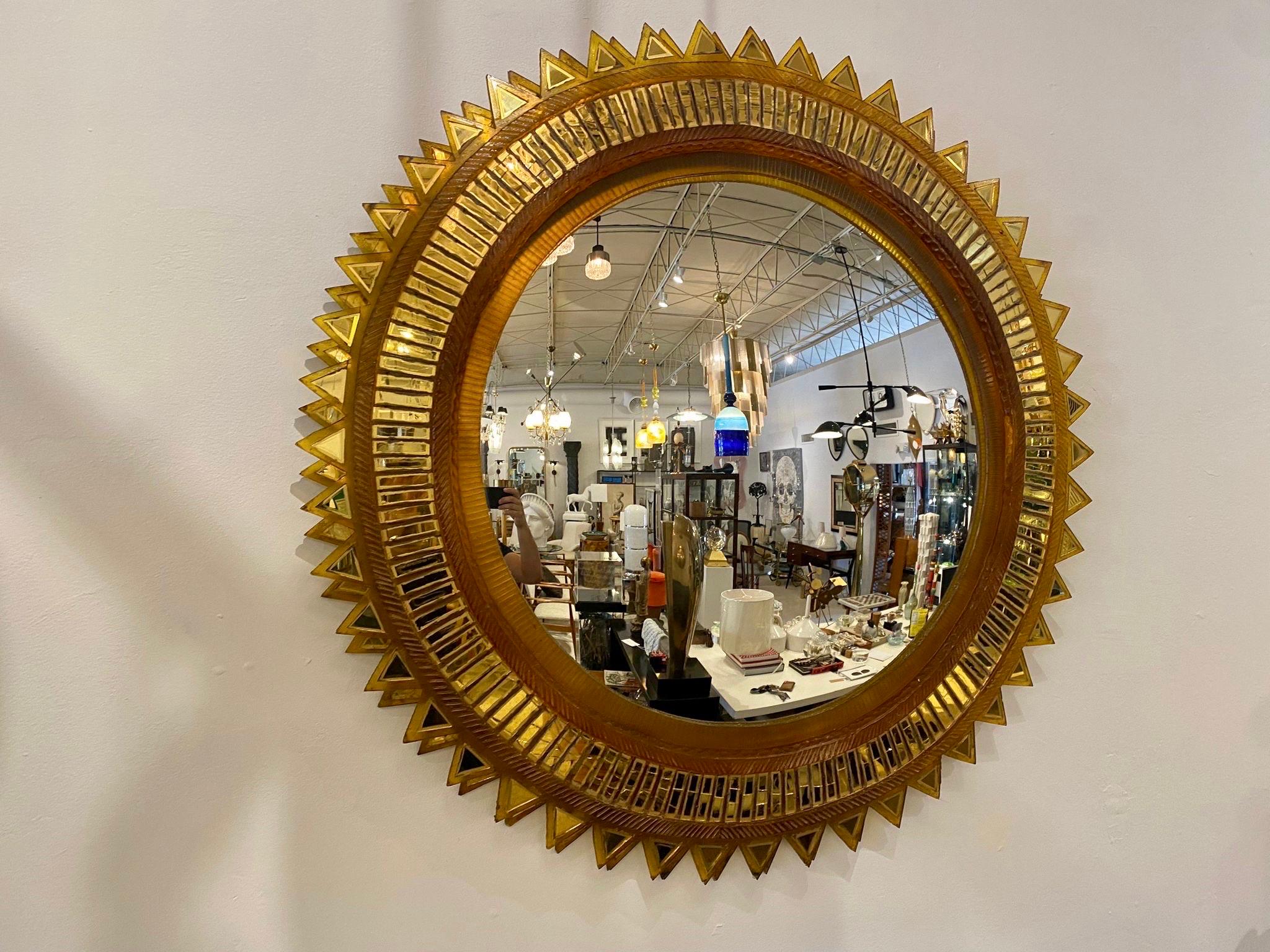 ZAJAC AND CALLAHAN Convex sunburst mirror, USA, second half of the 20th C.; Resin, Talosel, mirrored glass; Unmarked; Measures 43 inches in diameter (central convex mirror measures 27 inches in diameter). Provenance: Property from the Estate of