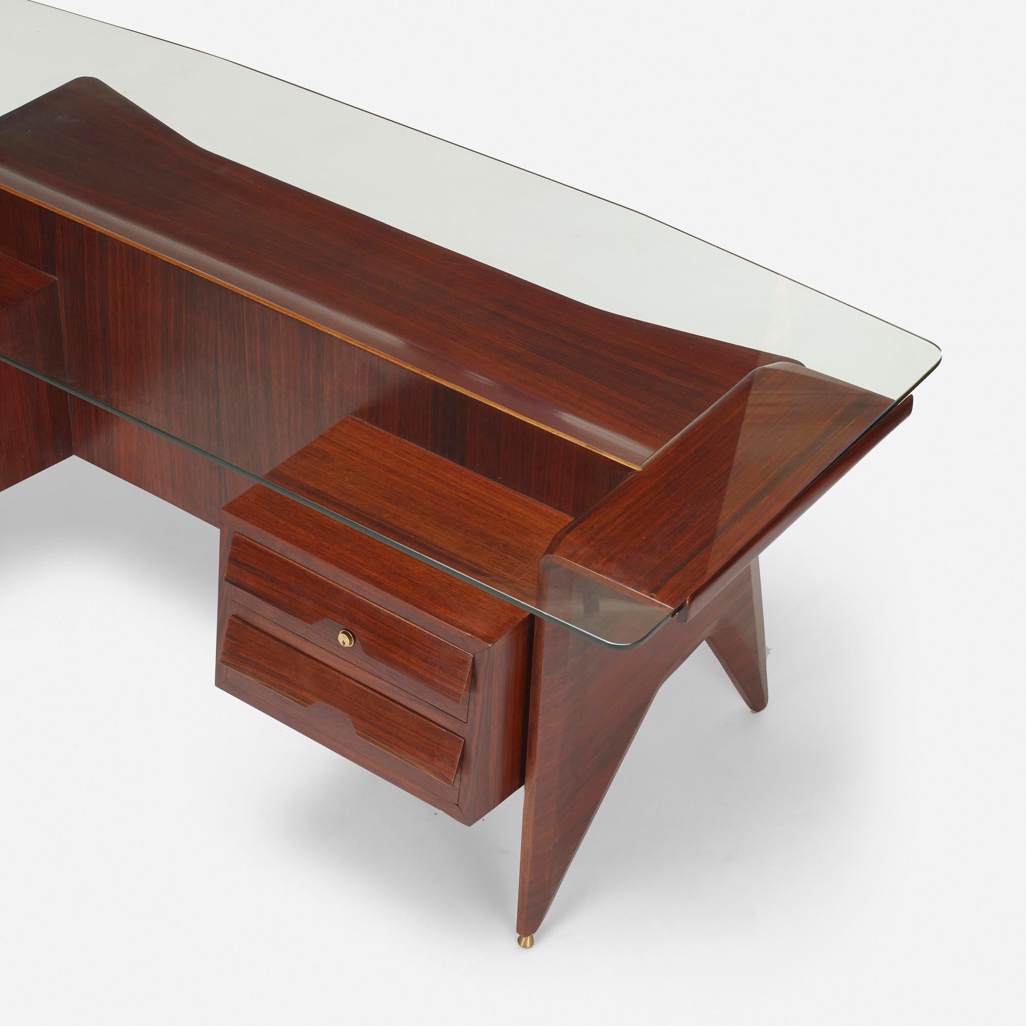 Important desk designed by Gio Ponti.
Produced by Dassi.
Measures: L 79” x W 34.5”x H 30.5”
Mahogany, glass and brass (brass sabots are adjustable)
1949,
Italy

Letters of authenticity
1. Laura Falconi (expert of Gio Ponti) wrote 26 page