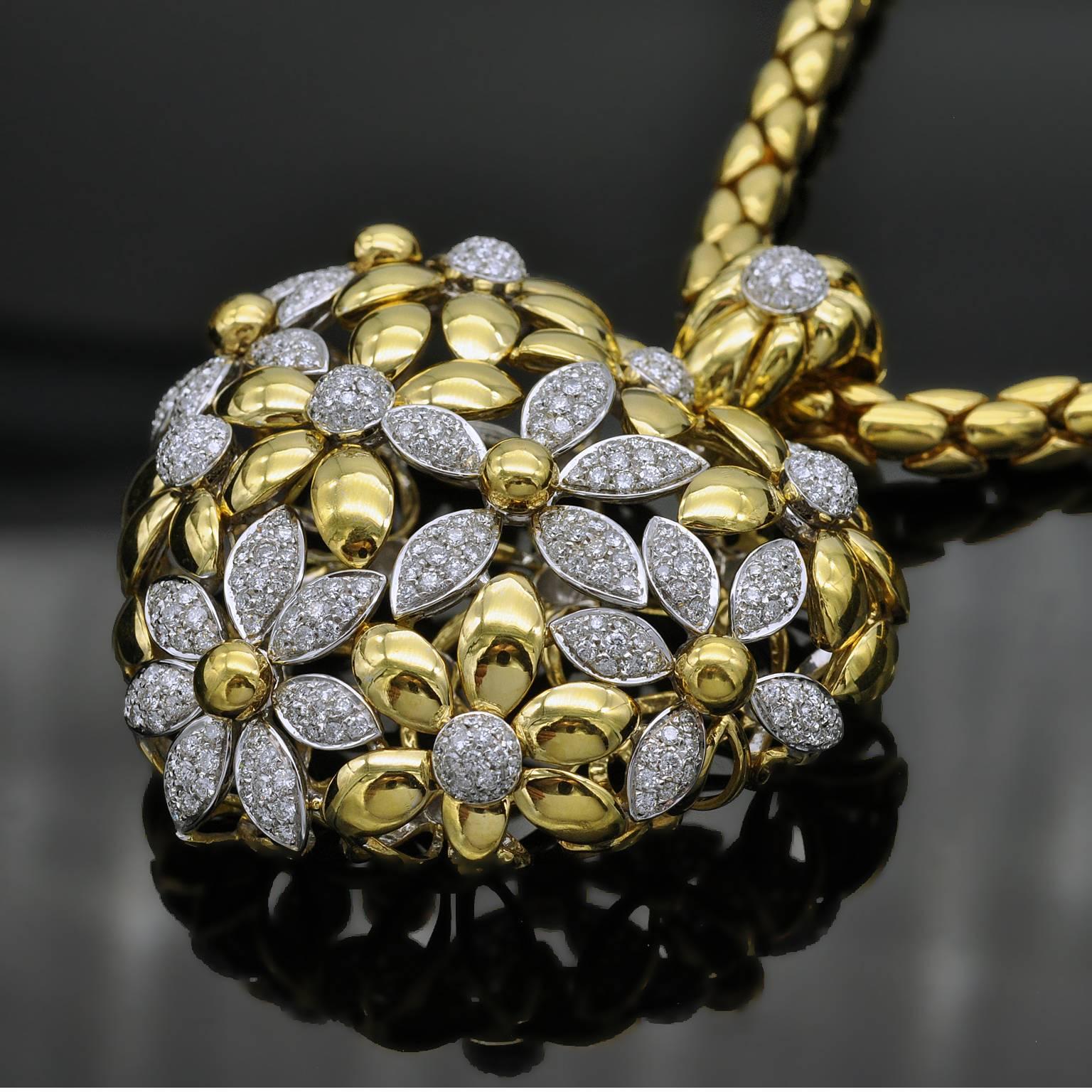 Superb and opulent puff heart pendant made out of flowers ! Shiny 18 kt gold and white diamond make a chic contrast. Beautiful make . The hoop open thanks to a discreet and sturdy system allowing heart to be attached to many different bands ( gold