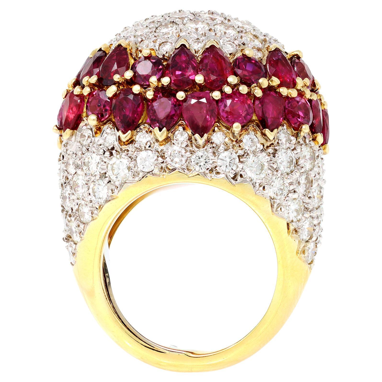 An important dome ring Circa 1970 featuring pave diamonds set in a honeycomb fashion. The dome is separated by a double row of mix cut rubies, with matched color. The ring is set in 18 karat yellow gold and has a guard inside the shank allowing for